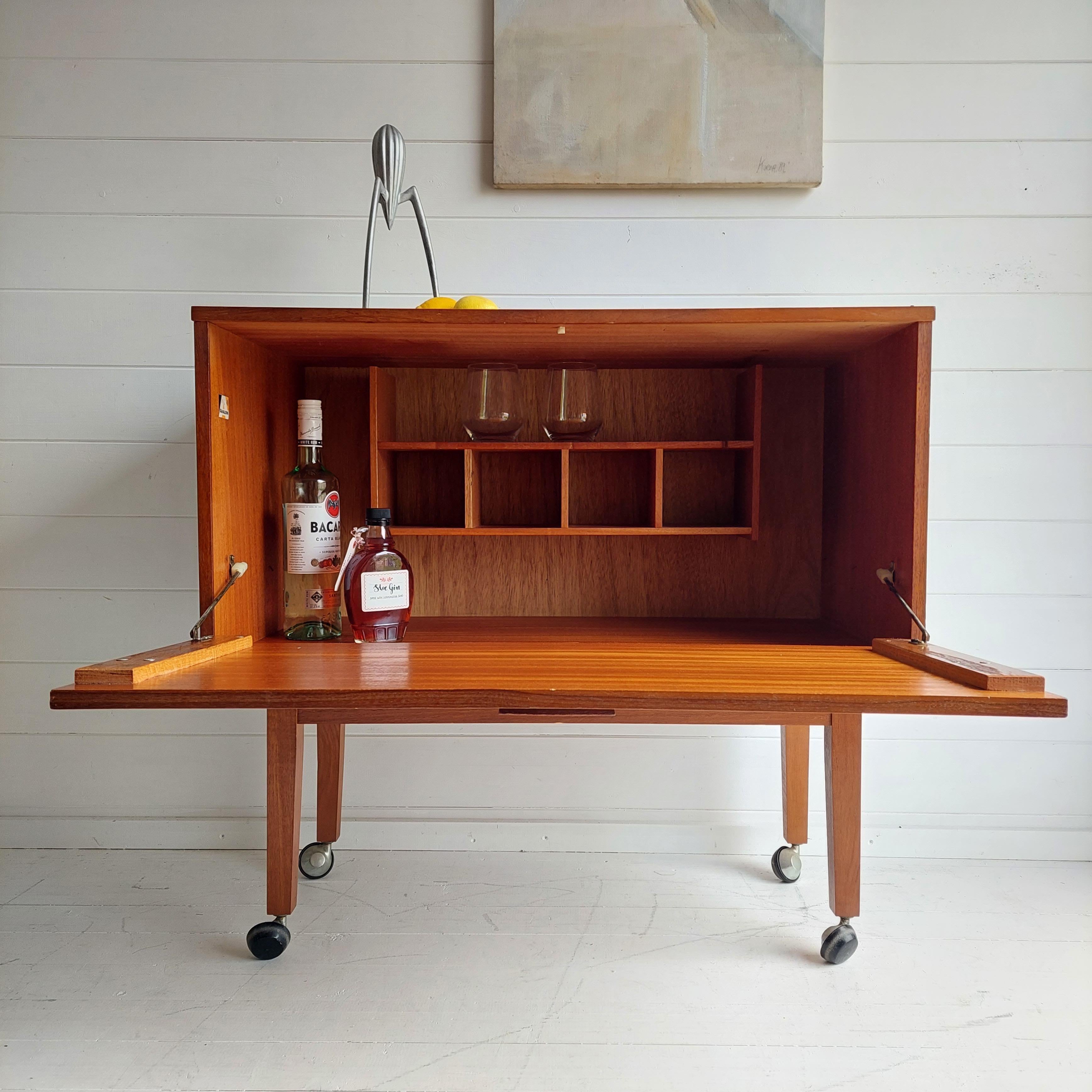 Mid-Century Modern Mid Century Teak Bar Cabinet on wheels By Avalon, Poul Cadovius style, 1965.