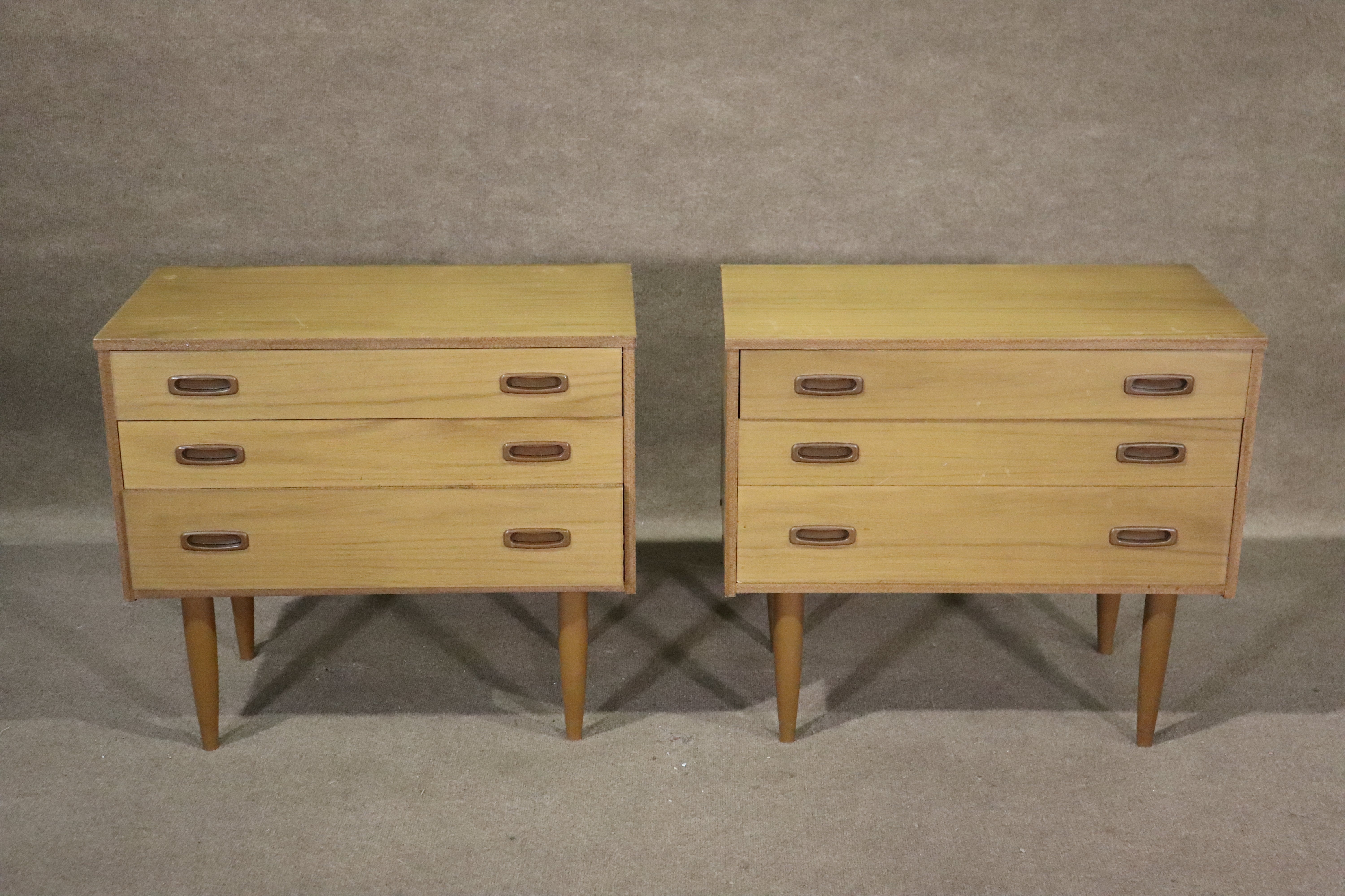 Pair of mini chest of drawers in teak with tapered legs. Great for bedside use with three drawers each.
Please confirm location NY or NJ