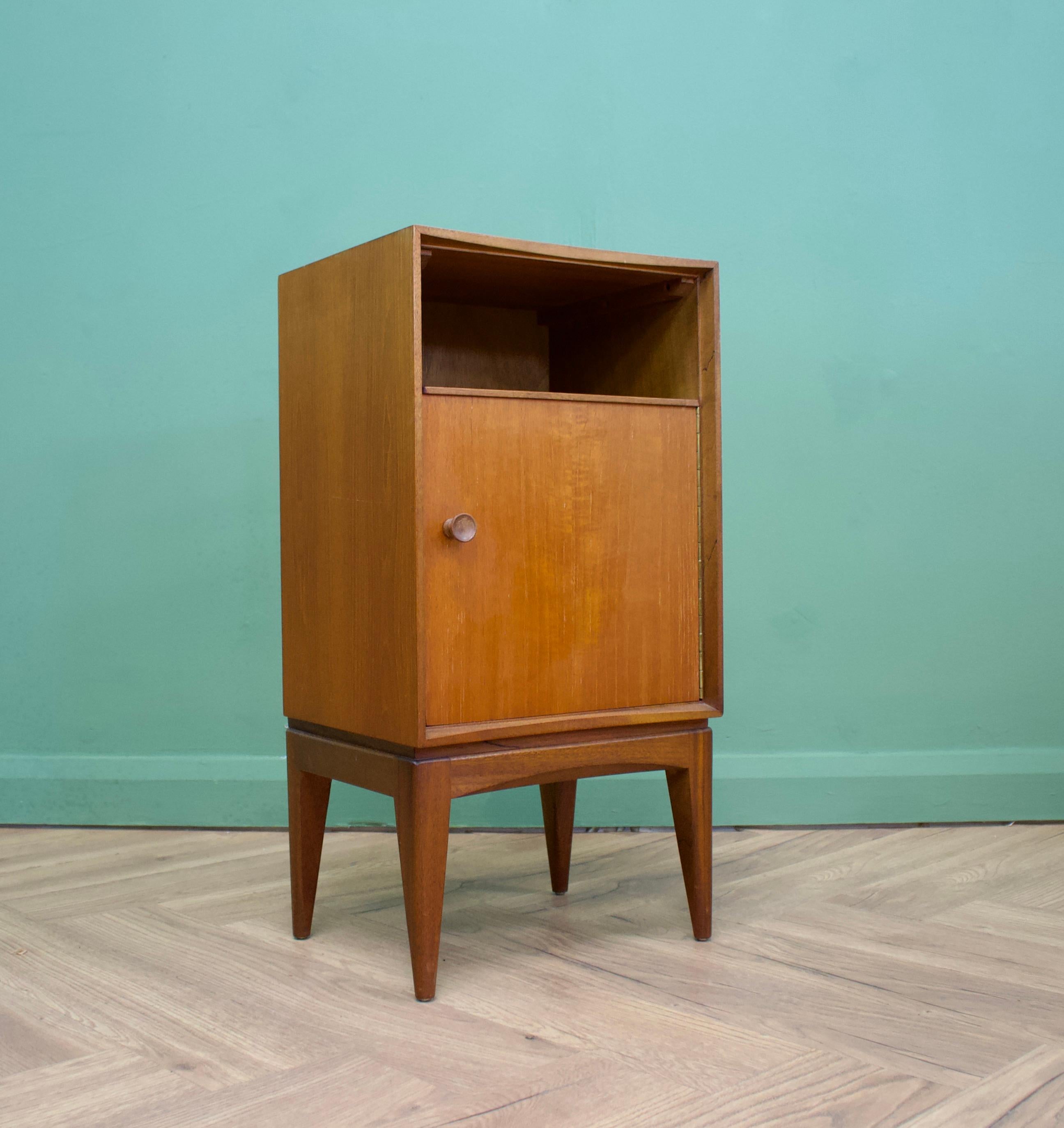 A teak  bedside table from Loughborough Furniture - retailed through Heals during the 1950s - designed by Neville Ward and Frank Austin
There are unusual brass inlay details to the bottom
This piece can be used as a lamp or side table also