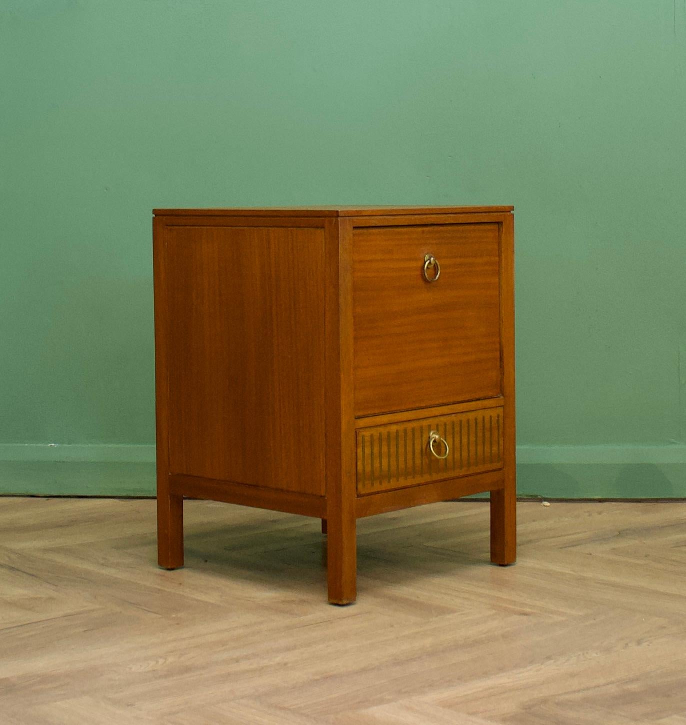 A teak  bedside table from Loughborough Furniture - retailed through Heals during the 1950s - designed by Neville Ward and Frank Austin
There are unusual brass inlay details to the bottom
This piece can be used as a lamp or side table also
