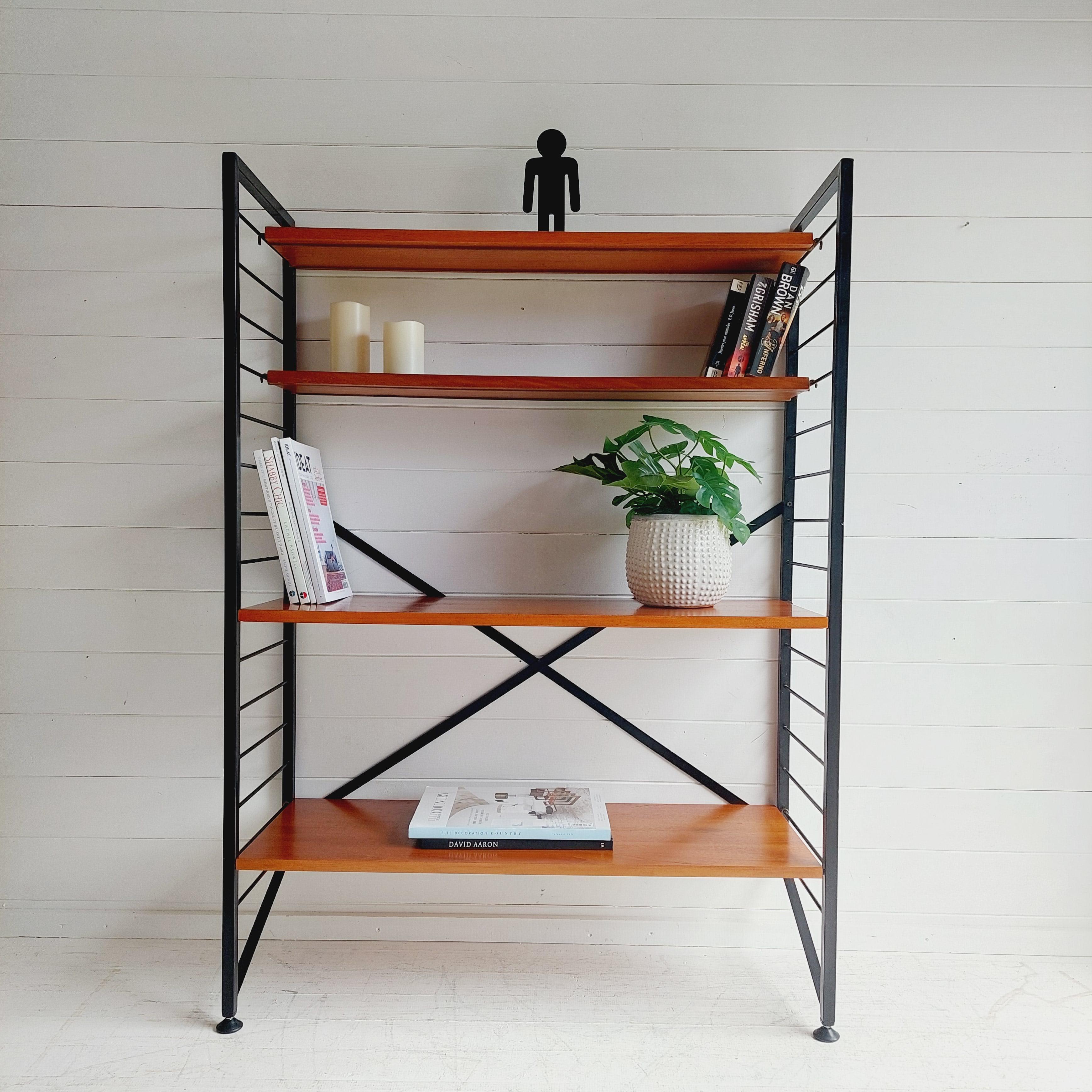 Minimalist design, flexible and functional, 
The classic Staples 'Ladderax' mid century shelving system. 
Designed by Robert Heal and manufactured for Staples of Cricklewood. Circa 1960's.
Single bay of Ladderax shelving unit

Constructed of