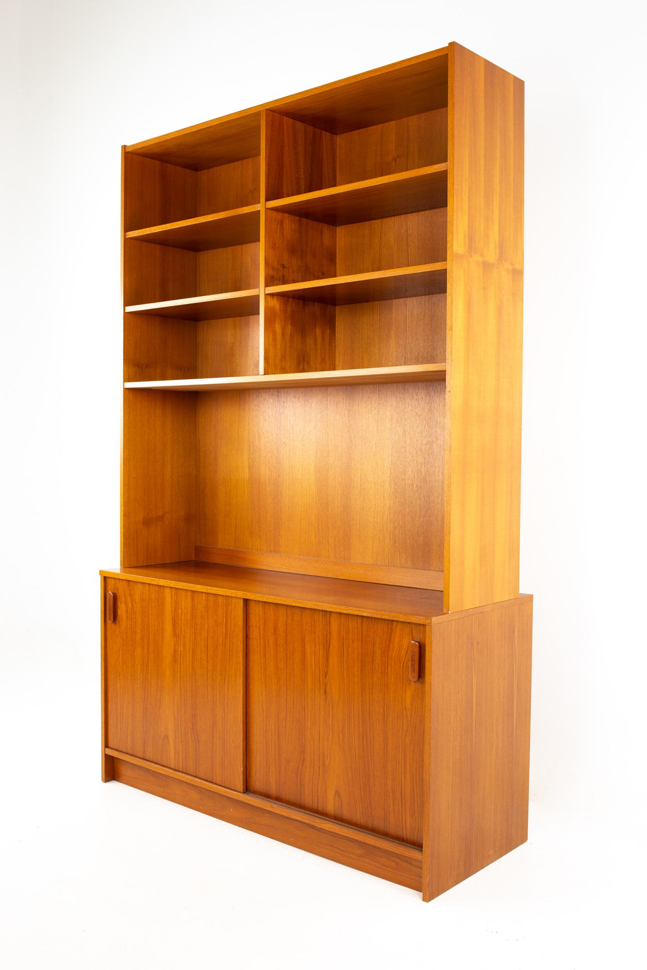 Mid century teak book case buffet and hutch
Buffet and hutch measure: 47.25 wide x 18 deep x 76.25 inches high
Buffet without hutch measures: 47.25 wide x 18 deep x 25.5 inches high

All pieces of furniture can be had in what we call restored