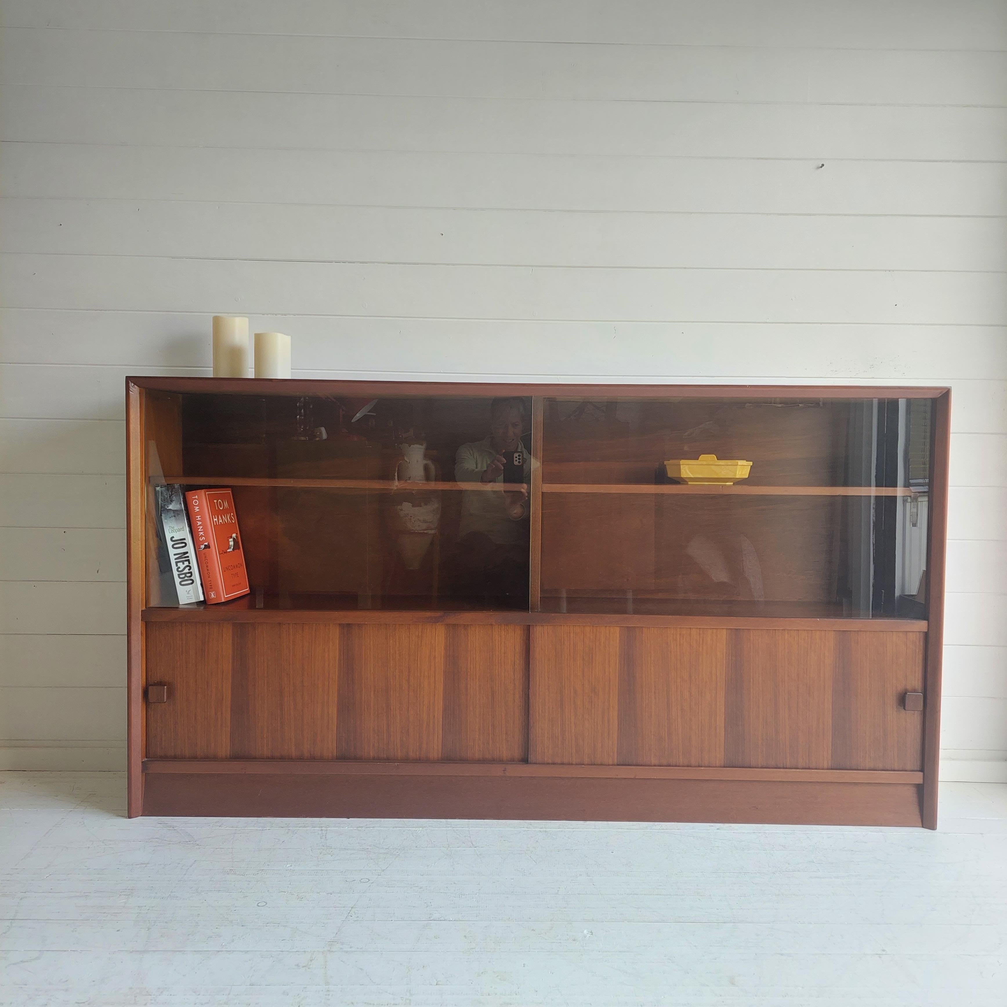Mid Century bookshelf cabinet sideboard by Herbert E Gibbs, 1960s
LARGE VINTAGE 1960S HERBERT E GIBBS MODEL 916 BOOKCASE WITH LOWER CUPBOARD
Formed part of Herbert E Gibbs limited edition Autograph range

Practical storage pieces like this bookcase