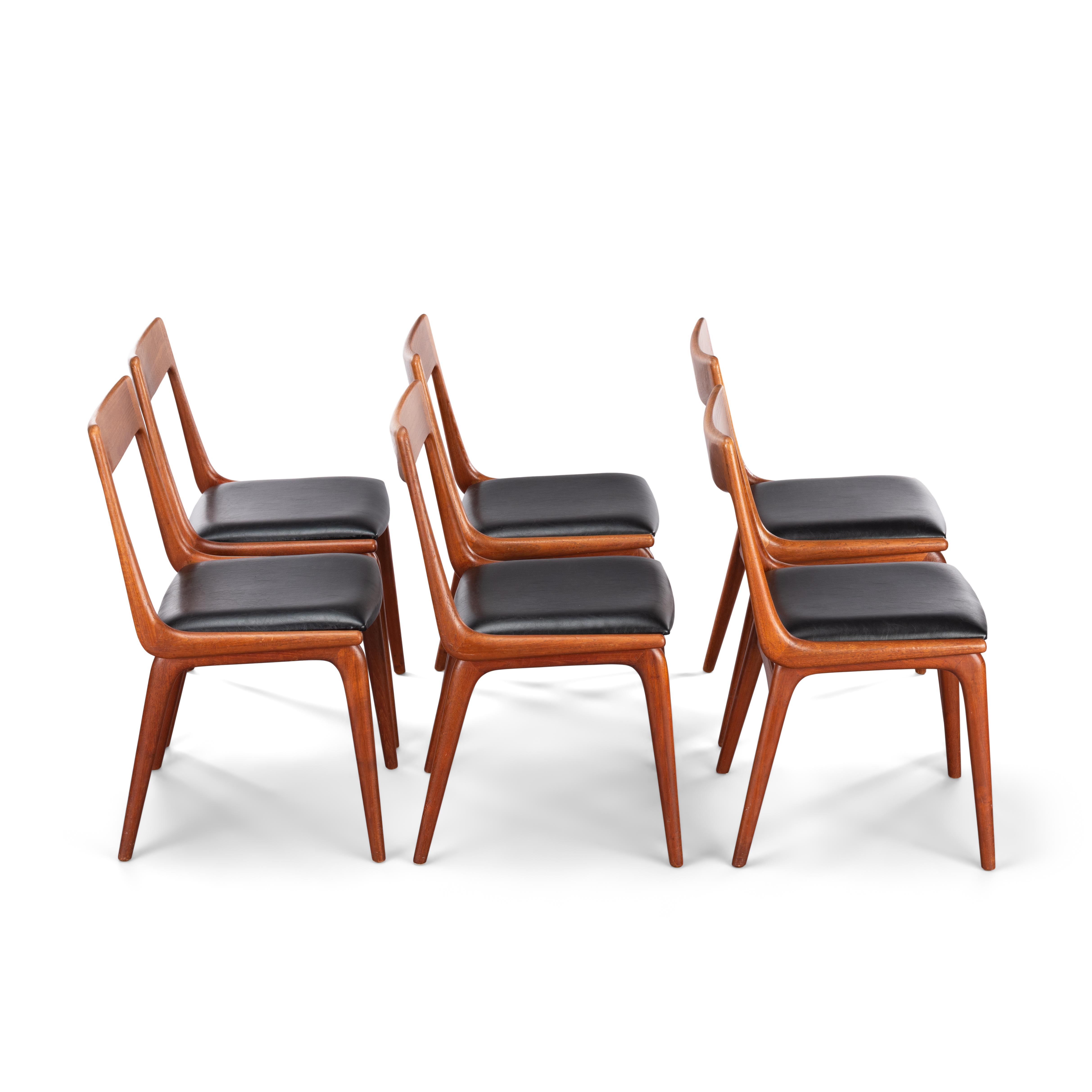 These Danish modern dining chairs from the mid-1960s were designed by Erik Christensen for Slagelse Møbelvaerk and are made from solid teak. The name and appeal of the chairs, numbered #370 is taken from the boomerang shape of the seat and back. The