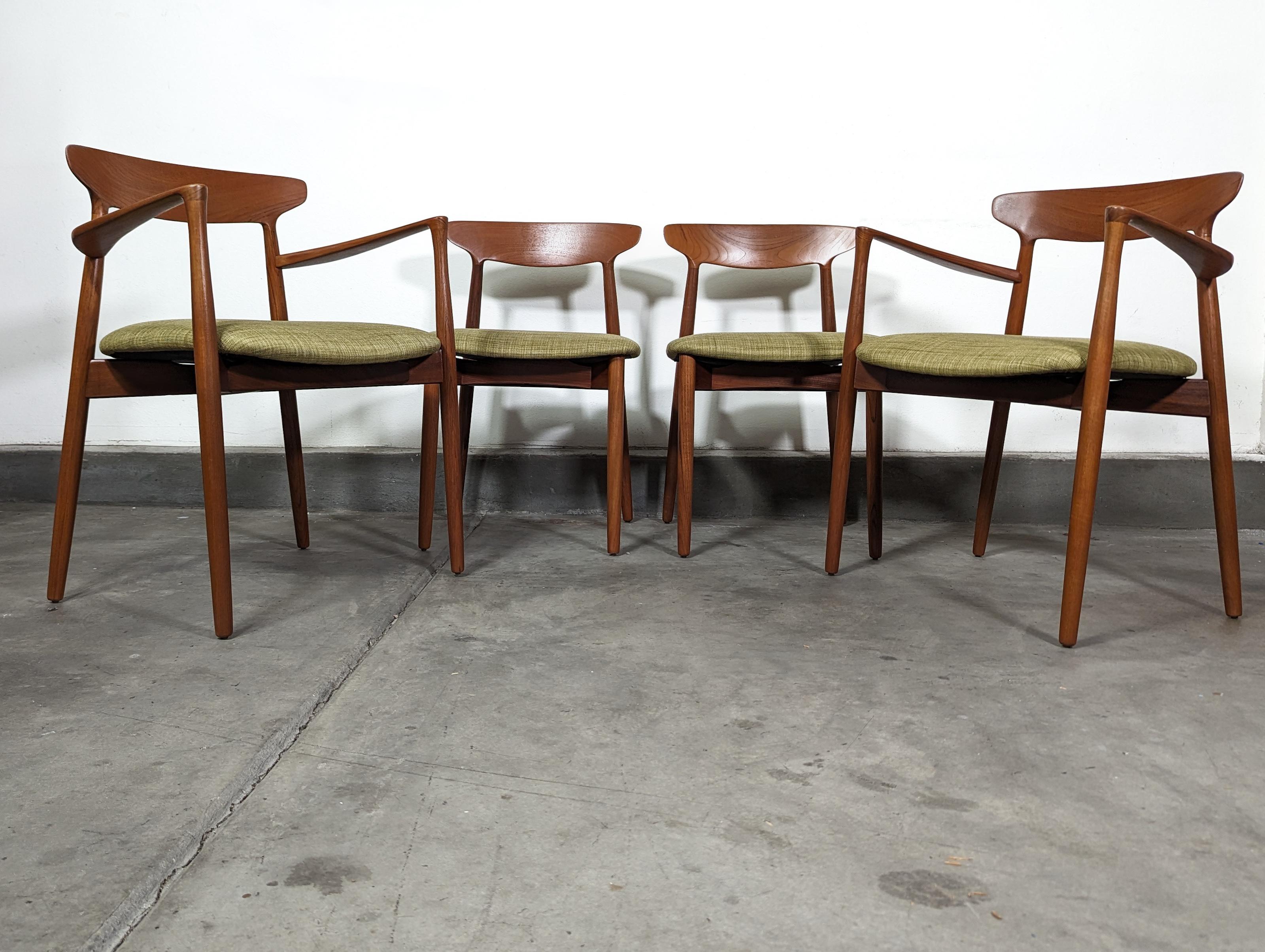 Presenting a remarkable set of four mid-century modern chairs, designed by the renowned furniture designer, Harry Østergaard for Randers Møbelfabrik in the 1960s. Masterfully constructed of solid teak, these iconic pieces exude timeless elegance and