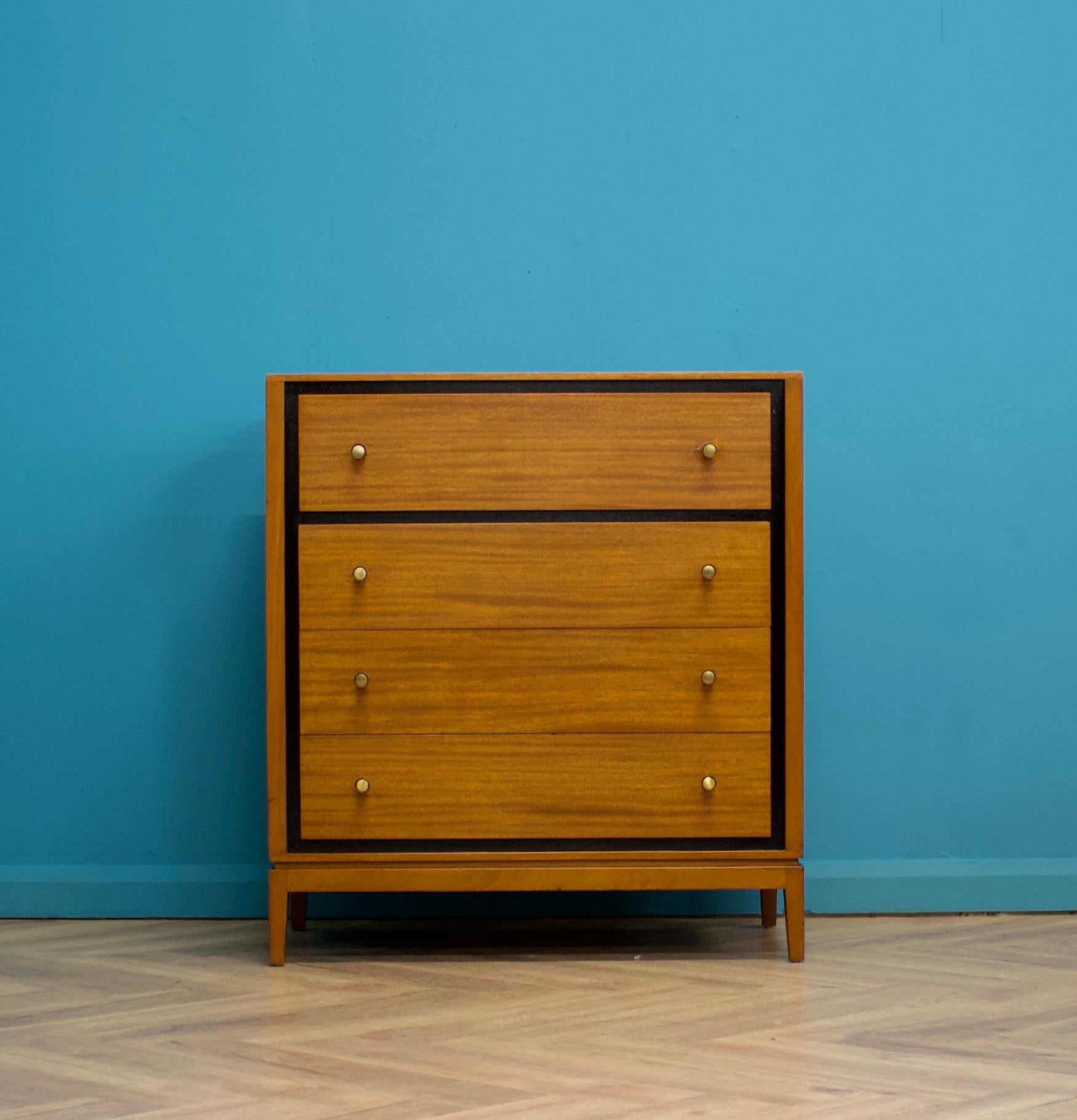 A teak & mahogany chest of drawers from Loughborough Furniture - retailed through Heals during the 1950s
With an ebonised trim

Featuring four drawers


The matching tallboy is listed for sale separately 