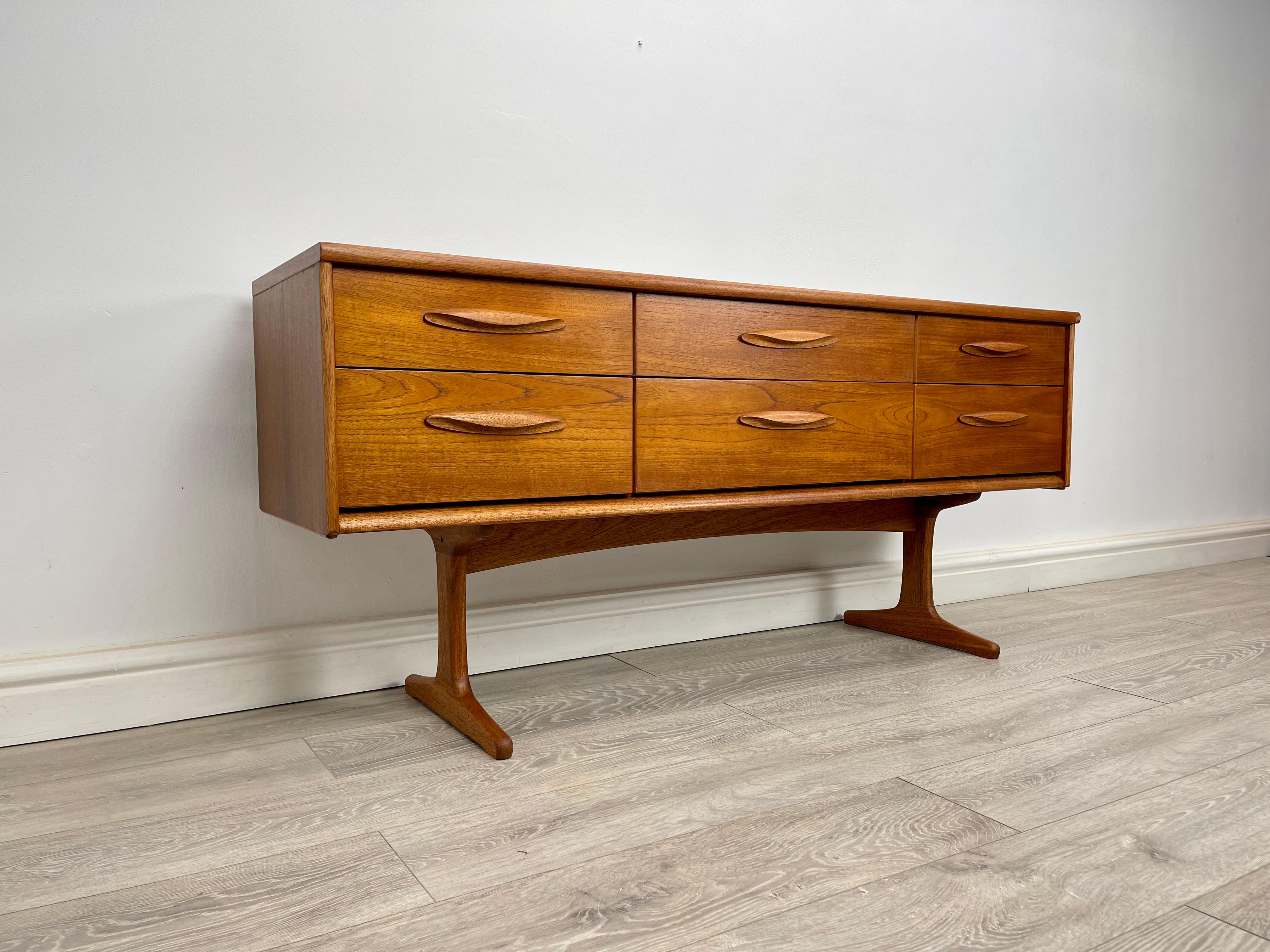 CHEST OF DRAWERS 
Midcentury teak chest of drawers / sideboard made by Austinsuite circa 1960 .

The chest of drawers has stunning grain and golden patina throughout.

There’s six drawers with solid teak handles , all drawers run