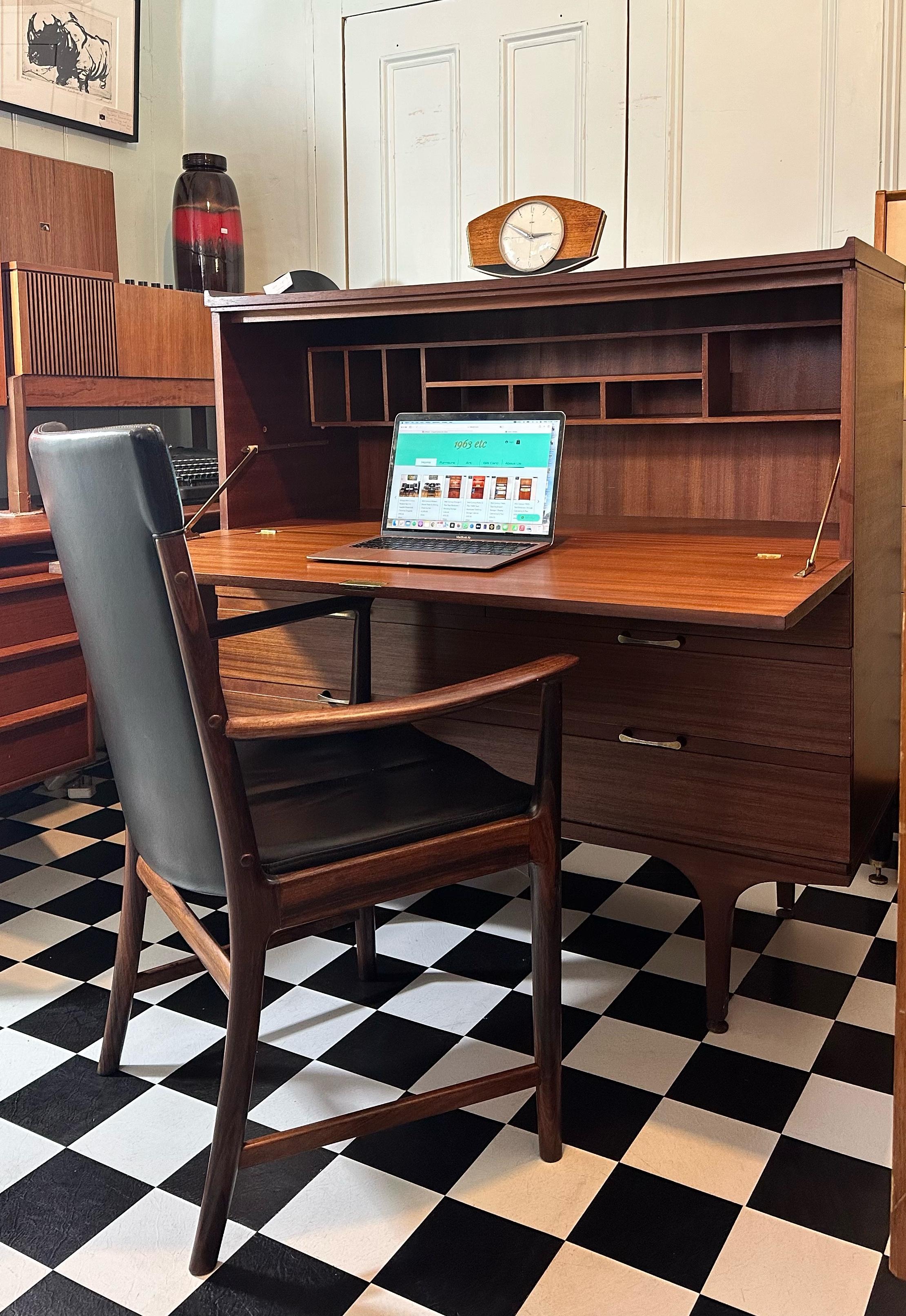 Beautiful vintage teak chest of drawers / writing desk / bureau by Meredew. Very compact piece which offers plenty of storage. Features drop down door (with original key) which reveals a large writing bureau section and letter compartments;