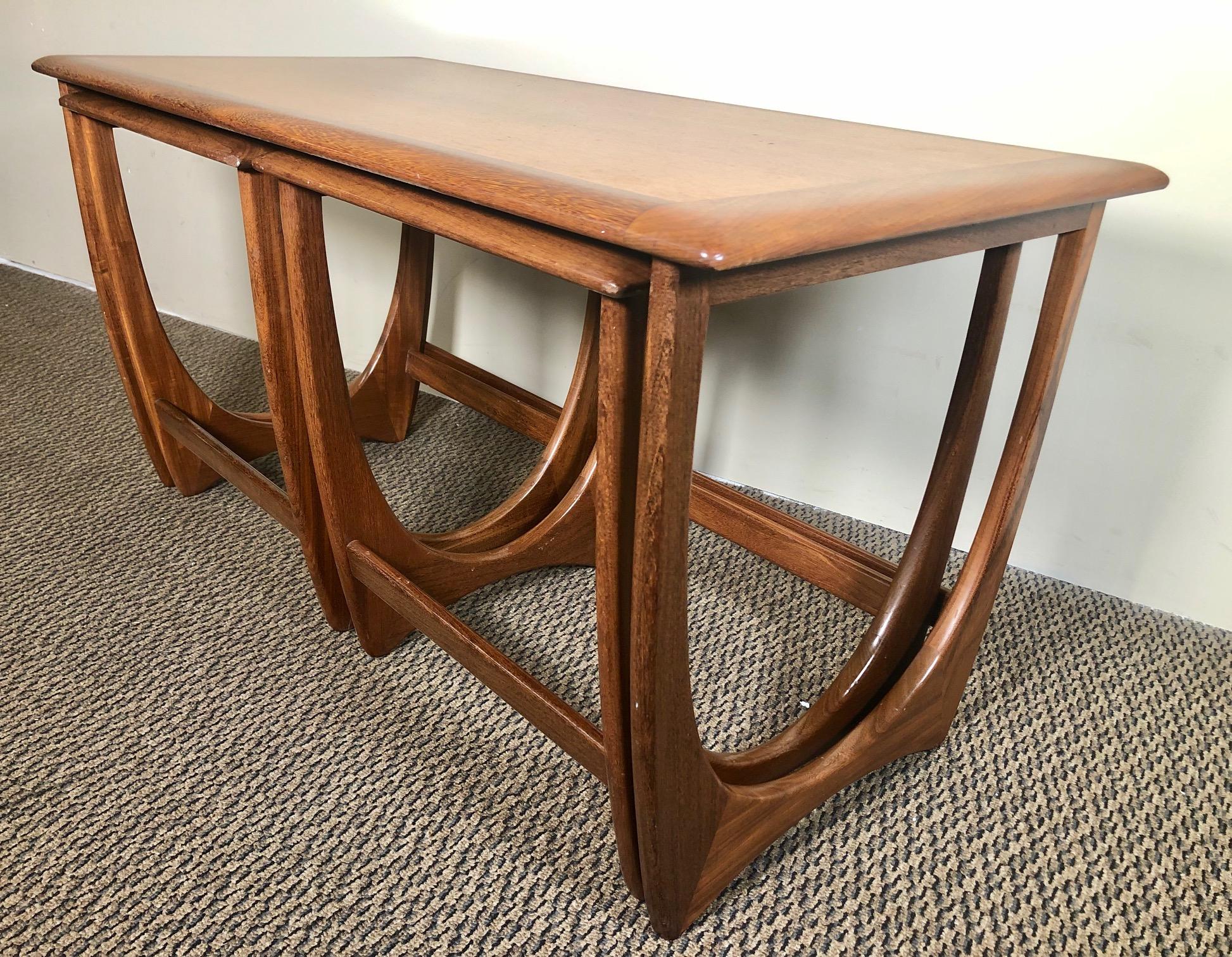 This is a gorgeous teak nesting coffee table with a beautiful leg design. Made by G Plan. 

Excellent condition. Minor signs of wear. Some small gouges but well looked after over the years.

Dimensions: L x W x H

Main table 39