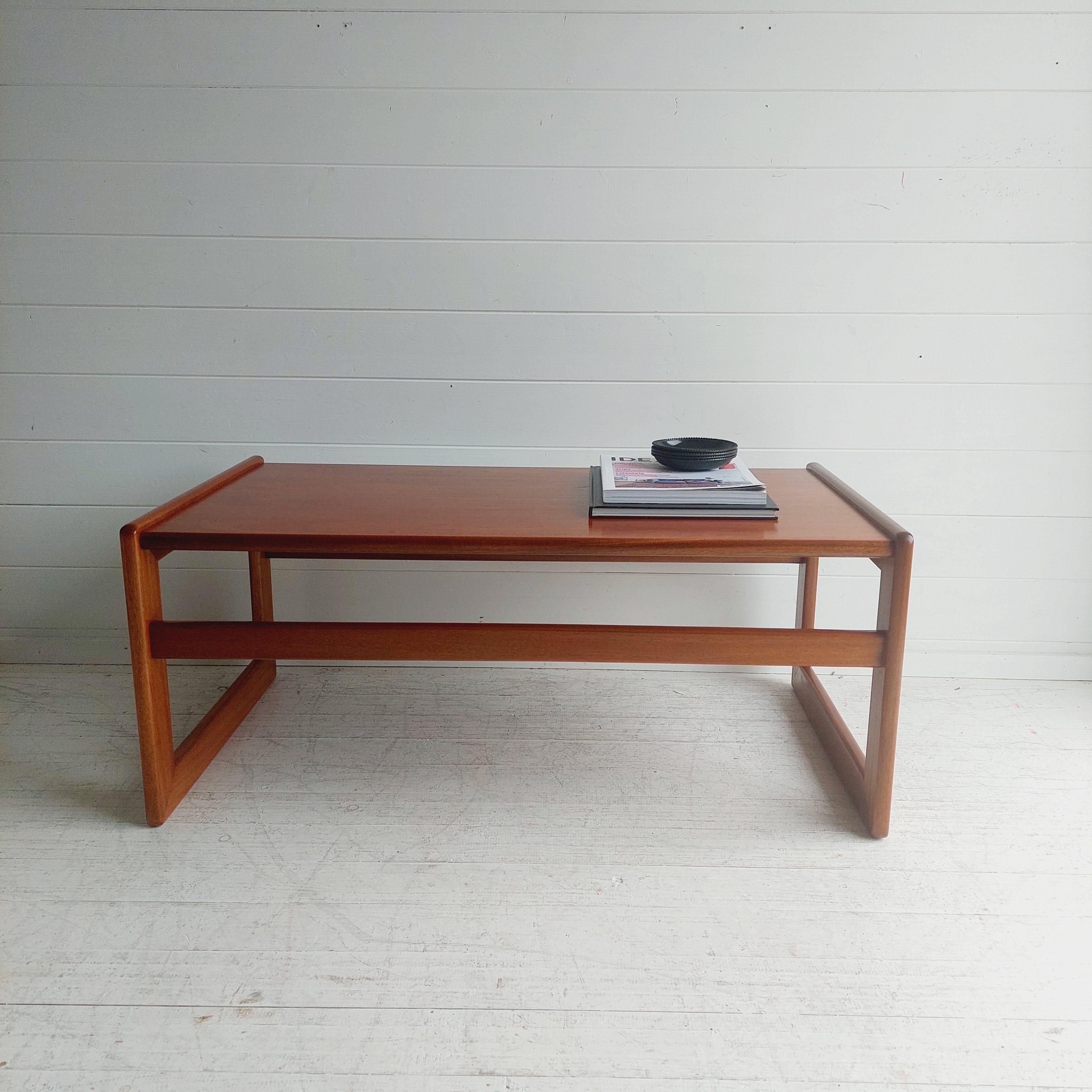 A 1960's teak coffee table designed in the style of Arne Hovmand Olsen afor Mogens Kold, Denmark. 

A very elegant design with beautiful styled modulars leg style base.
The table has been totally restored and look stunning, the grain is really