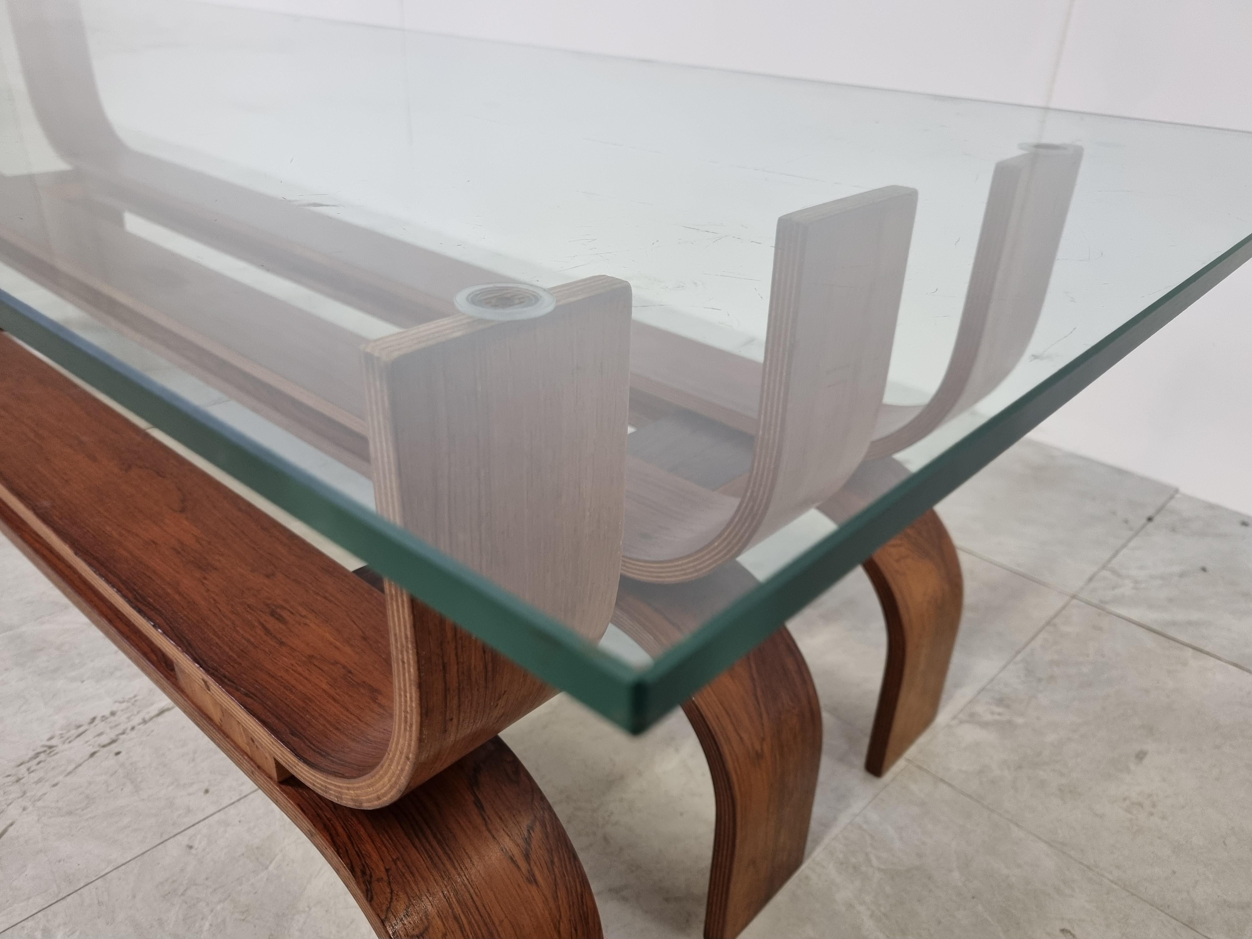Rare mid century bent teak coffee table with a clear glass top.

This large coffee table is beautifully crafted and has a timeless look.

1960s - Germany

Good condition

Dimensions:
Height: 46cm/18.11