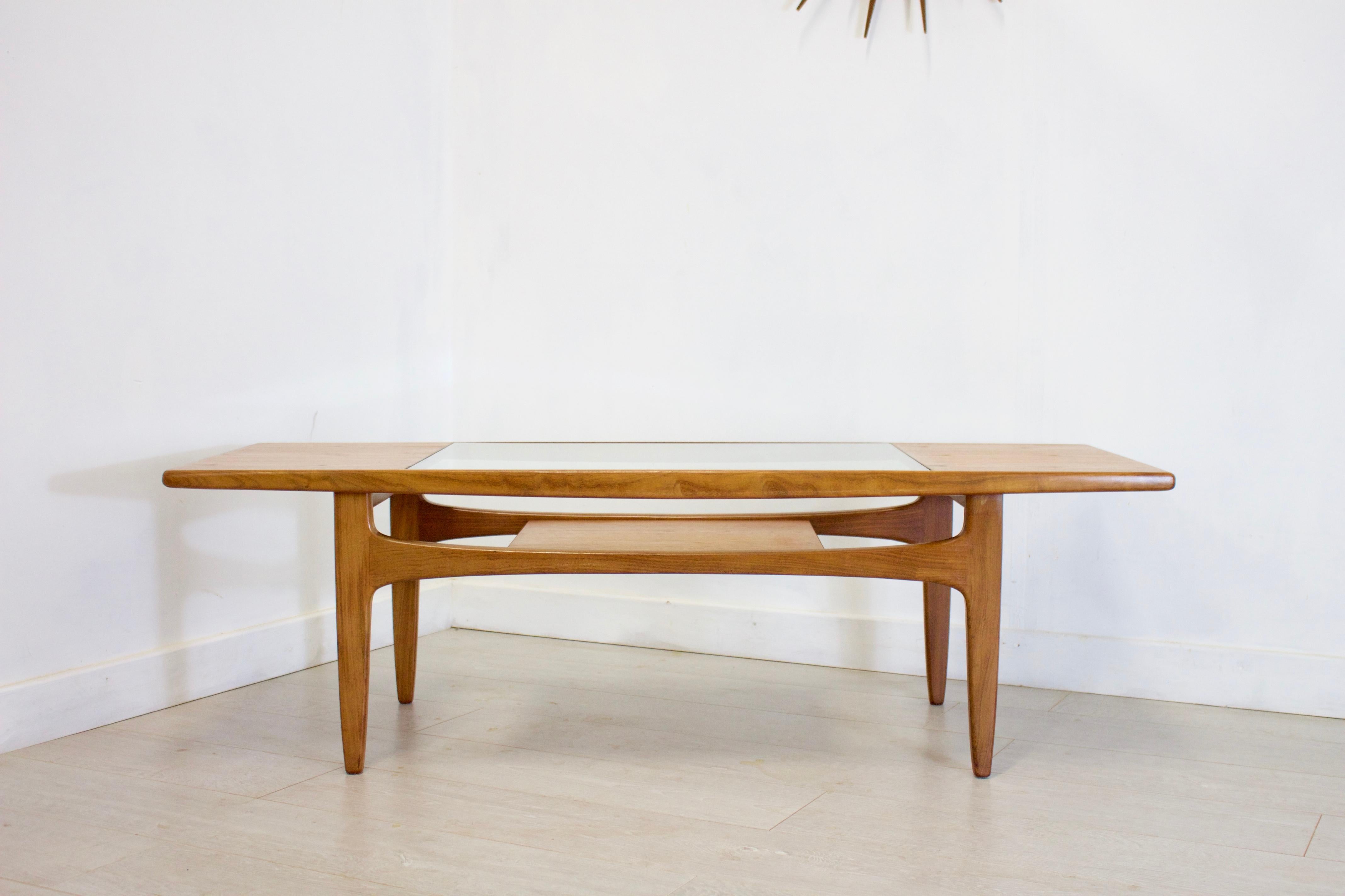 - Midcentury coffee table
- Designed by Victor Wilkins for G-Plan
- Made from teak and teak veneer.