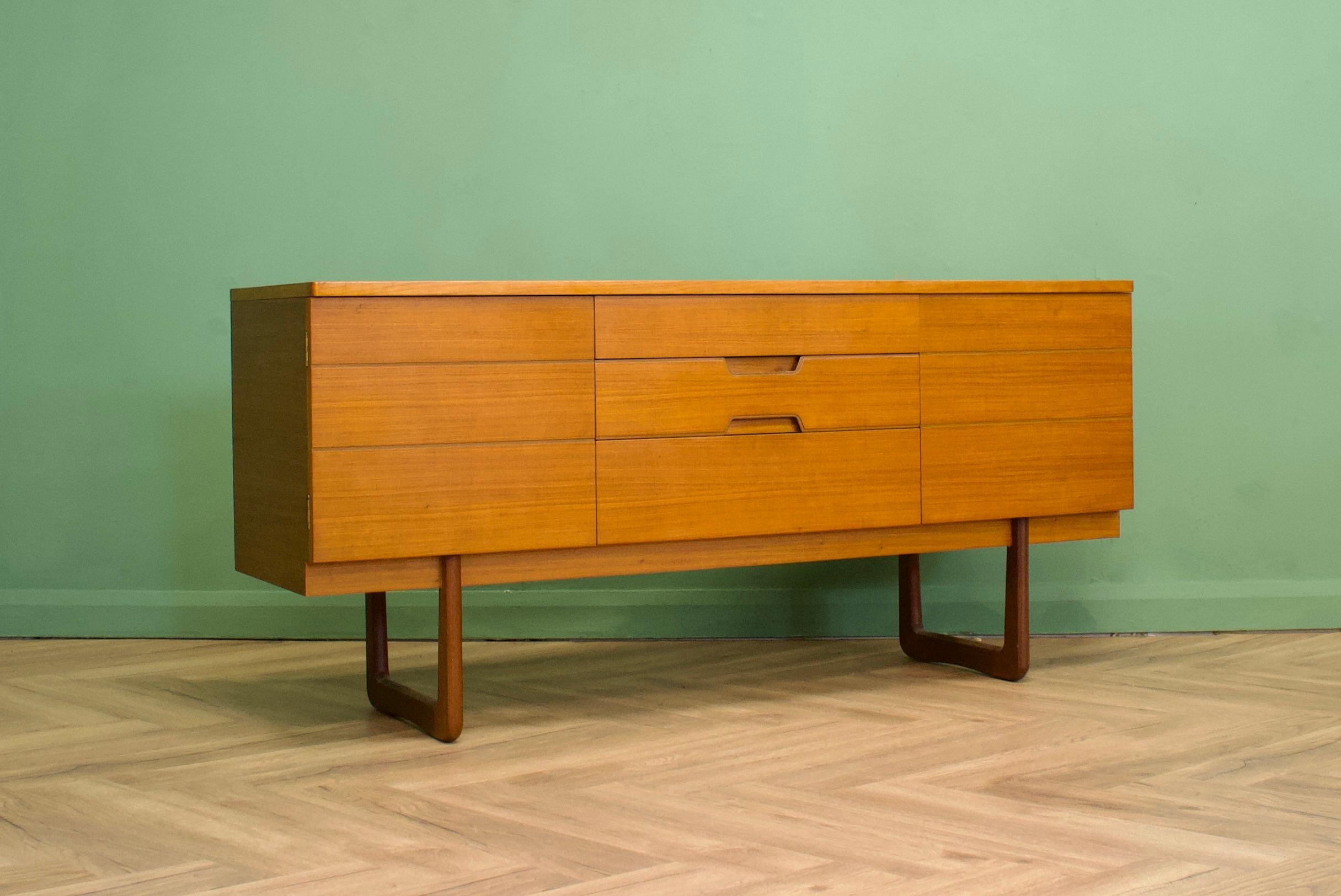 A teak compact sideboard by Gunther Hoffstead for Uniflex, which was originally a dressing chest  - Circa 1960s

It features three drawers and two push to open cupboards - each contain a fixed shelf

The piece has a minimalist modern design and to