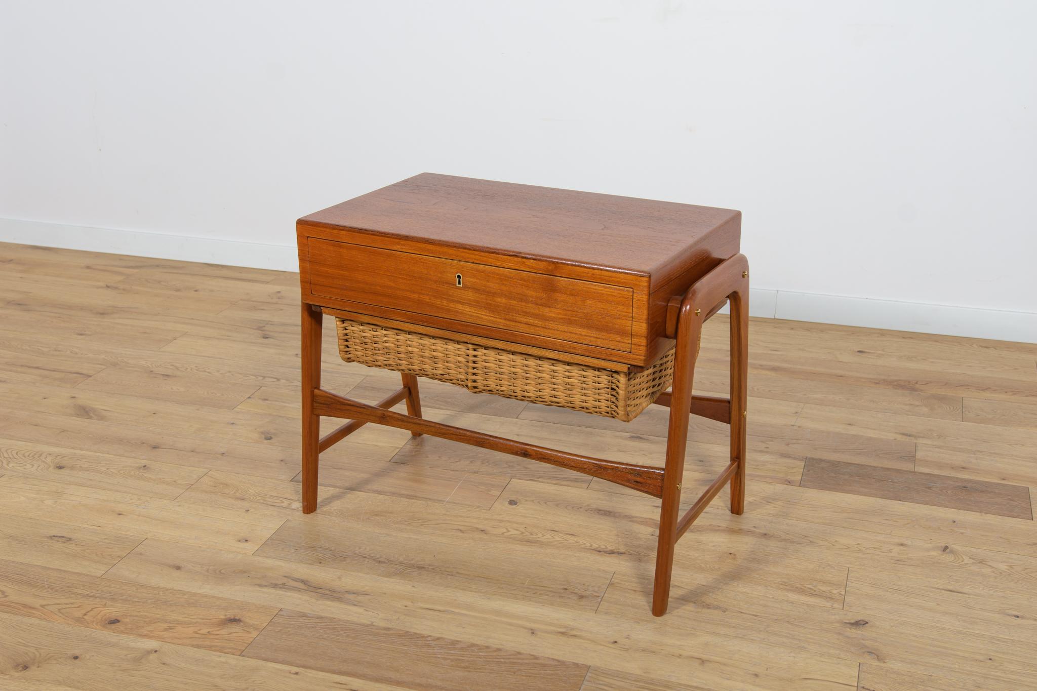 
Unique console made in Denmark in the 70s. Made of teak wood, in the lower part there is a wicker extendable drawer. It has undergone a thorough renovation, the wood has been cleaned of the old coating, and finished with Danish Rustins oil.