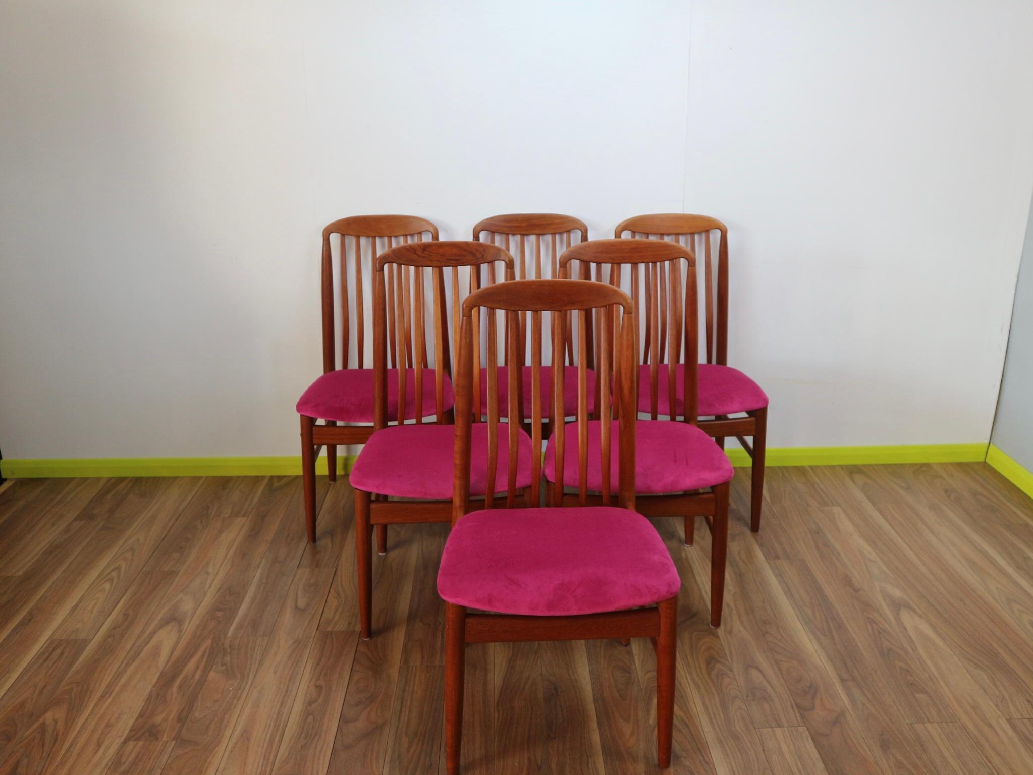 A gorgeous set of Danish design dining chairs made by Benni Linden. These chairs have fantastic lines and the back supports look amazing. The seat pads have recently ben reupholstered in vivid pink and really set the chairs off.