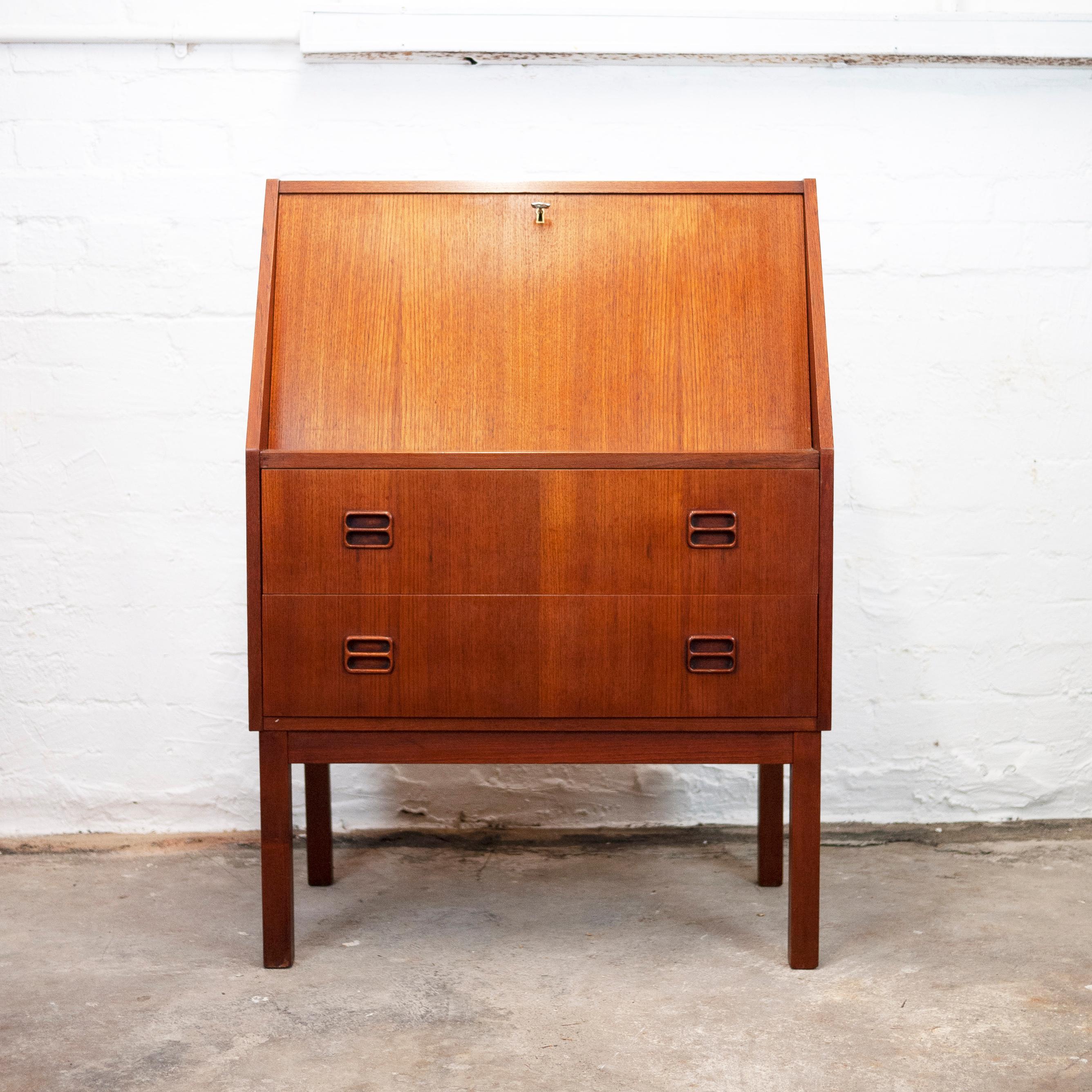 A teak Danish Bureau by Gunnar Nielsen Tibergaard, which features two drawers and a locked pull out desk with compartments.

Designer - Gunnar Nielsen Tibergaard

Design Period - 1960 to 1969

Country of Manufacture - Danish.