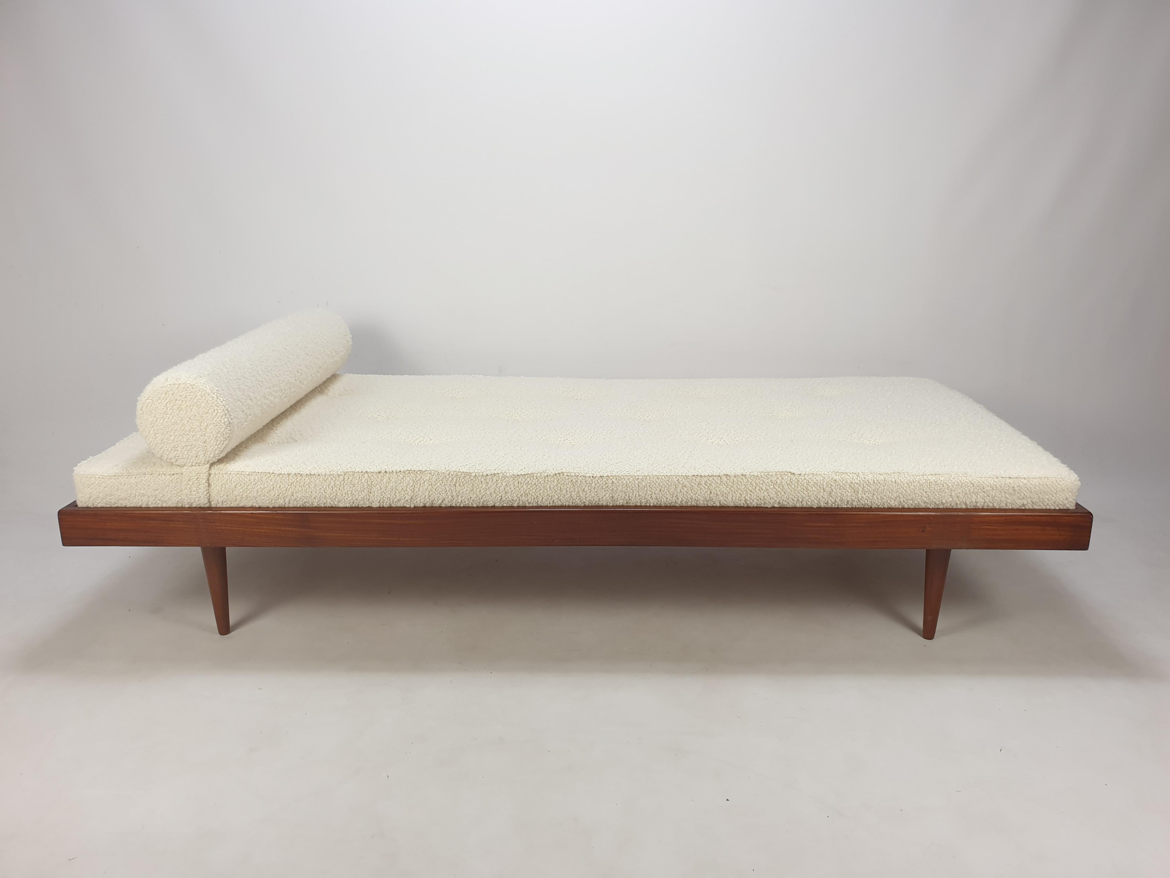 Very nice daybed, fabricated in The Netherlands in the 60's. 

The mattress is renewed with new foam and it has just been upholstered with lovely wool Italian bouclé fabric.

It is included the matching bolster. 

The daybed is made of solid