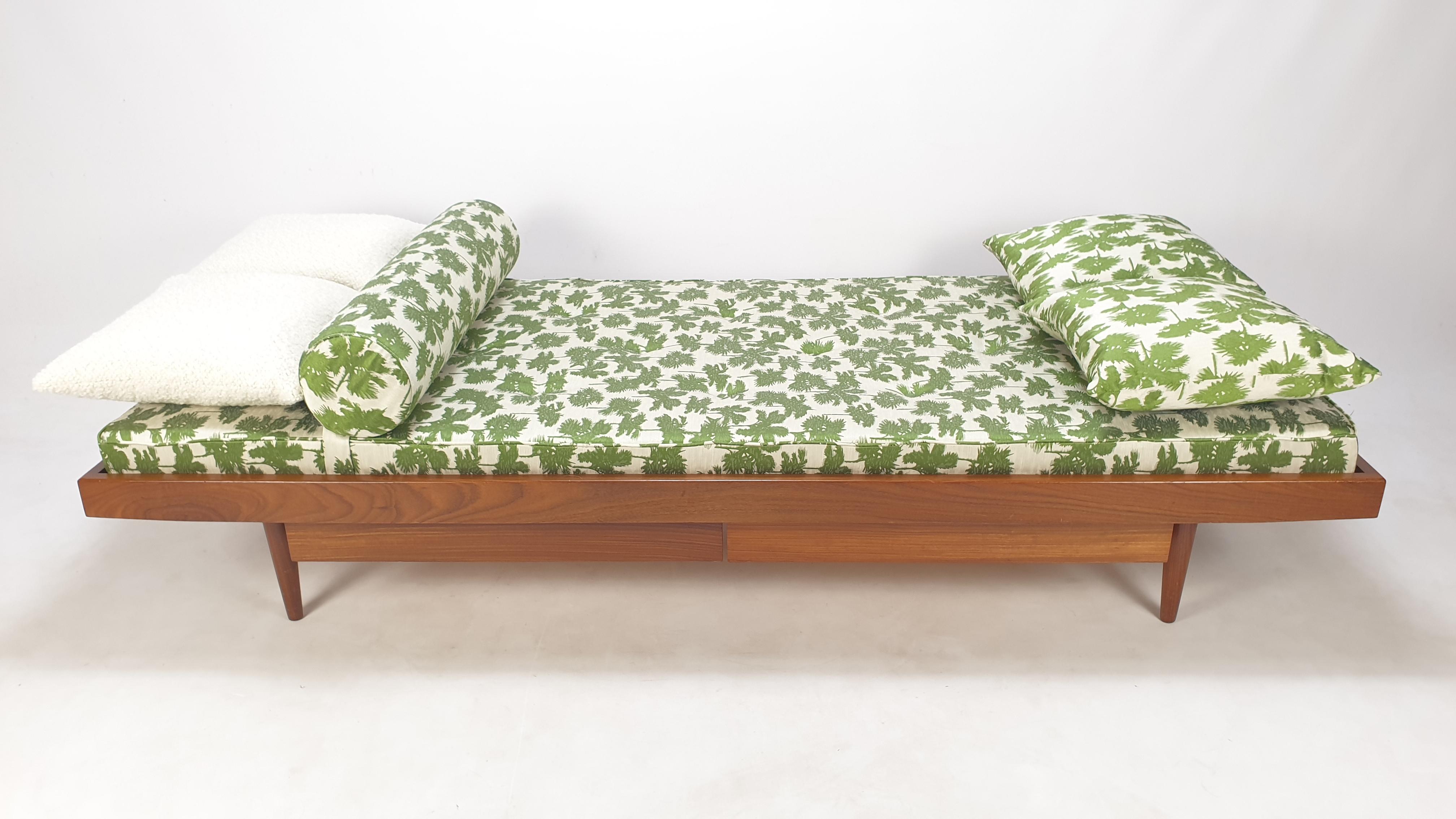 Very nice teak daybed, fabricated in The Netherlands in the 60's. 
Underneath the bed there are two drawers.

The mattress, bolster and cushions are renewed with new foam and they are just upholstered with stunning Dedar Italy fabric.

It is