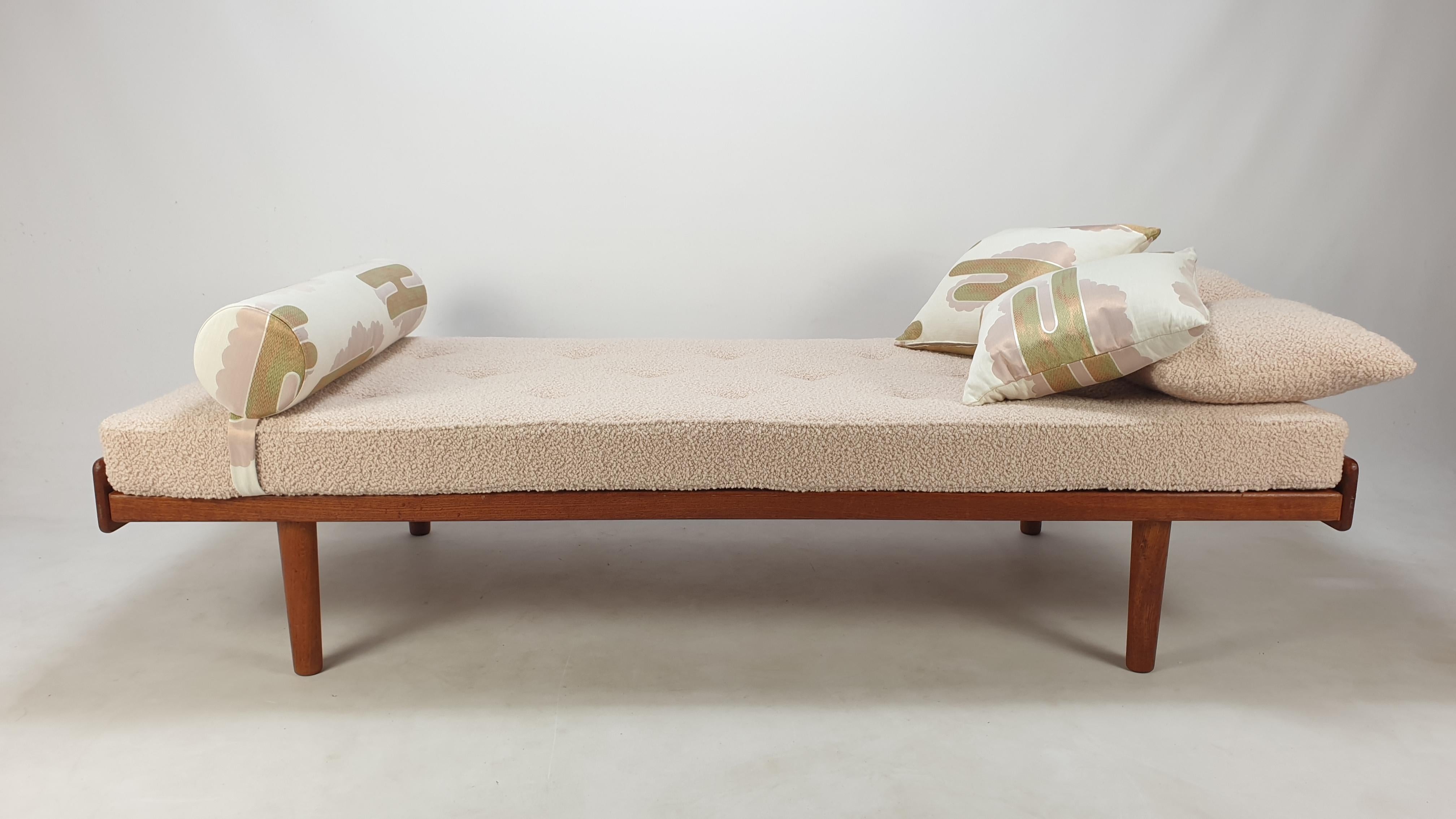 Very nice teak daybed, fabricated in The Netherlands in the 60's. 

The mattress, bolster and cushions are renewed with new foam and they are just upholstered with stunning Dedar Italy fabric.

It is included the matching bolster and the 4