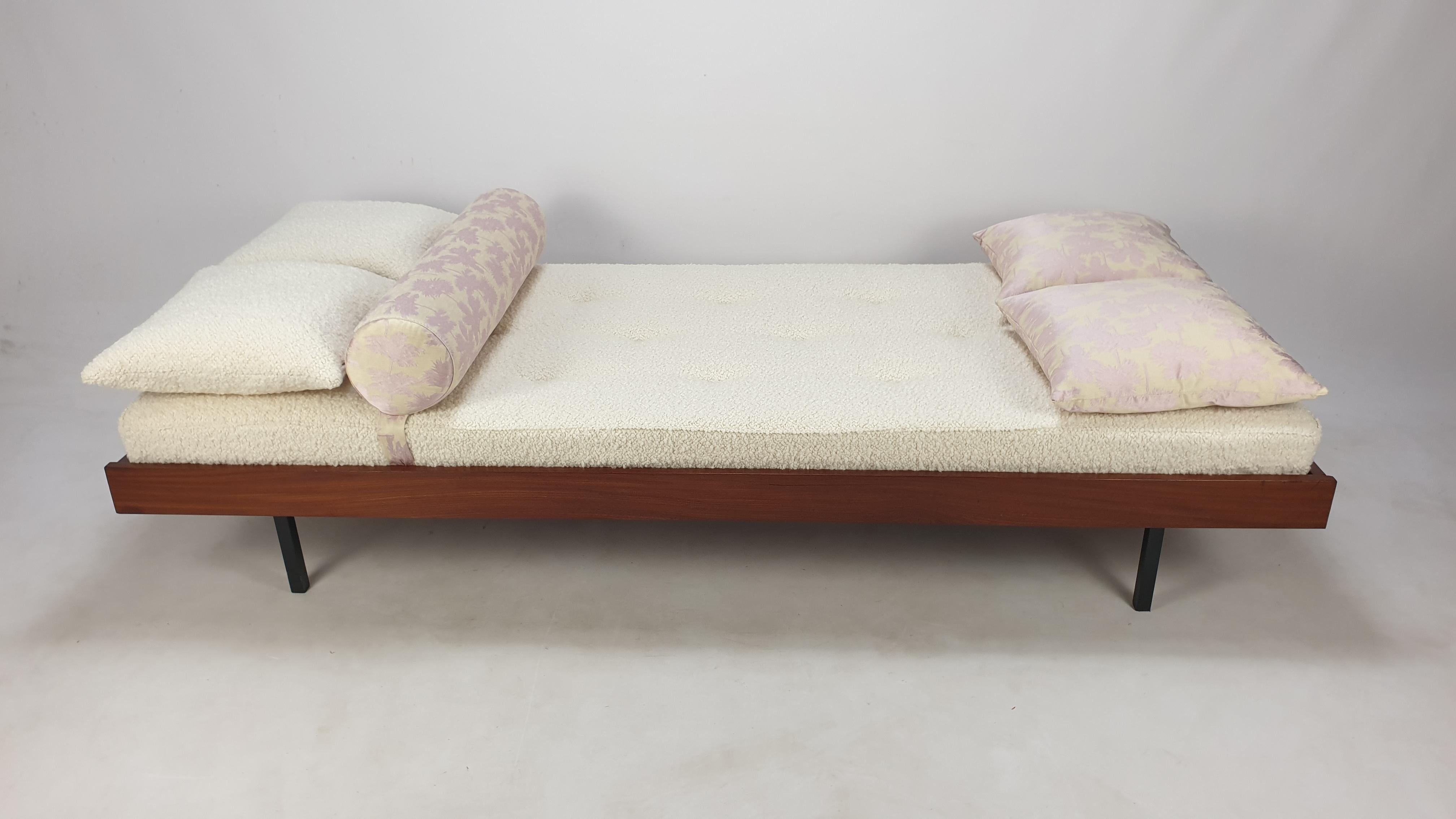Very nice teak daybed, fabricated in The Netherlands in the 60's. 

The mattress is renewed with new foam and it has just been upholstered with lovely Italian bouclé wool fabric, the same for two cushions.

The bolster and the two other cushions