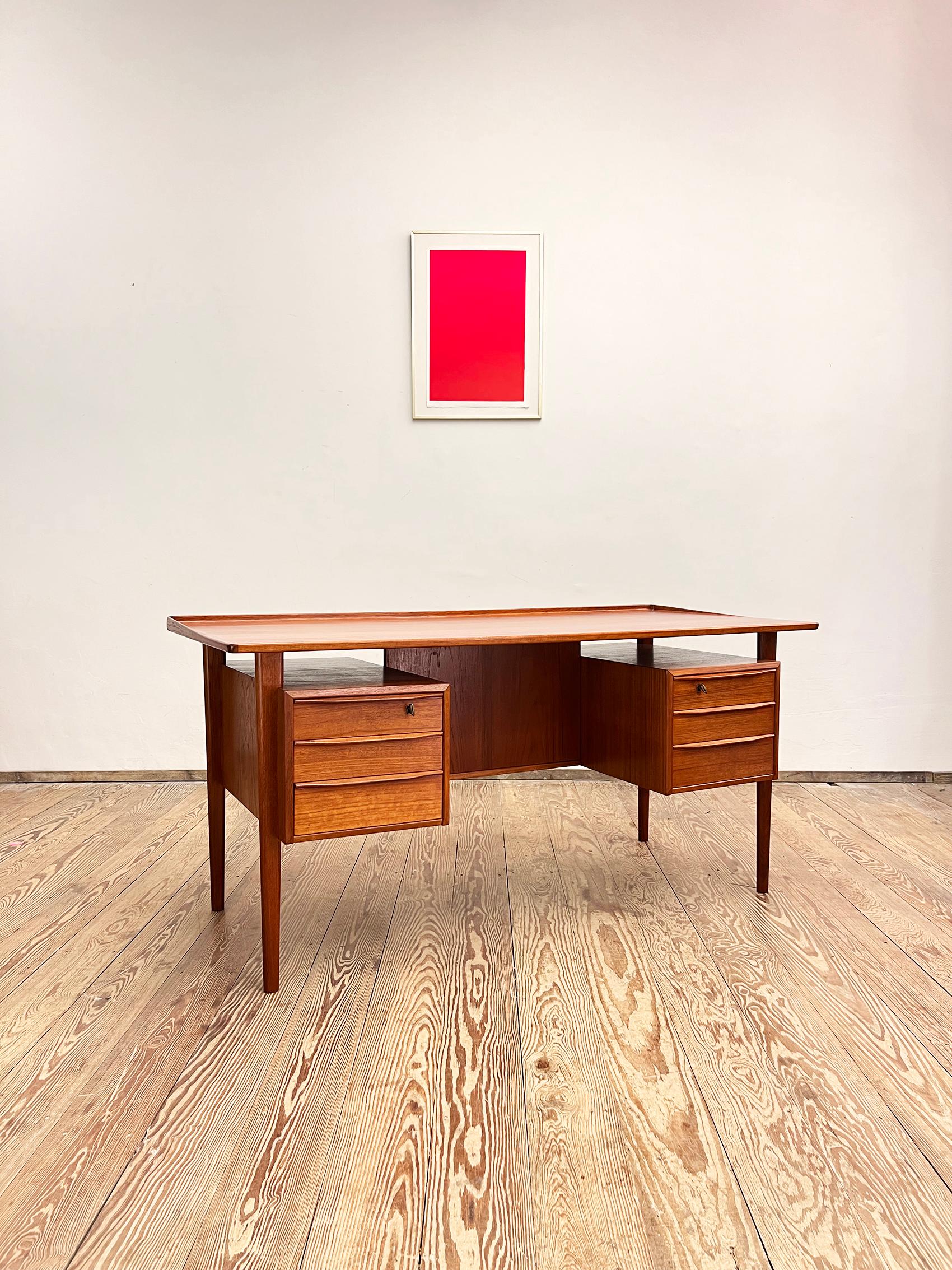 Dimensions 74 cm x 155 cm x 70 cm (Depth x Width x Height)


This free standing midcentury danish writing desk was designed by Peter Løvig Nielsen, produced by Hedensted Møbelfabrik Denmark in 1977. The table is made of teak wood and features two