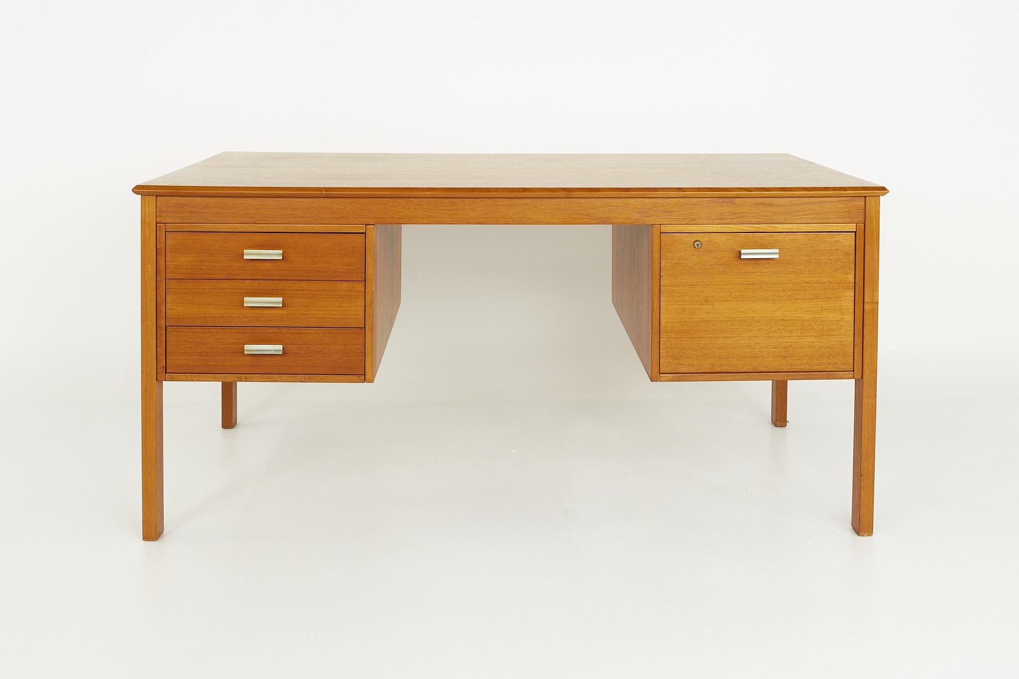 Farso Stolefabrik for Maurice Villency mid century Danish teak desk

This desk measures: 59 wide x 31.5 deep x 28.5 inches high, with a chair clearance of 26 inches

?All pieces of furniture can be had in what we call restored vintage condition.