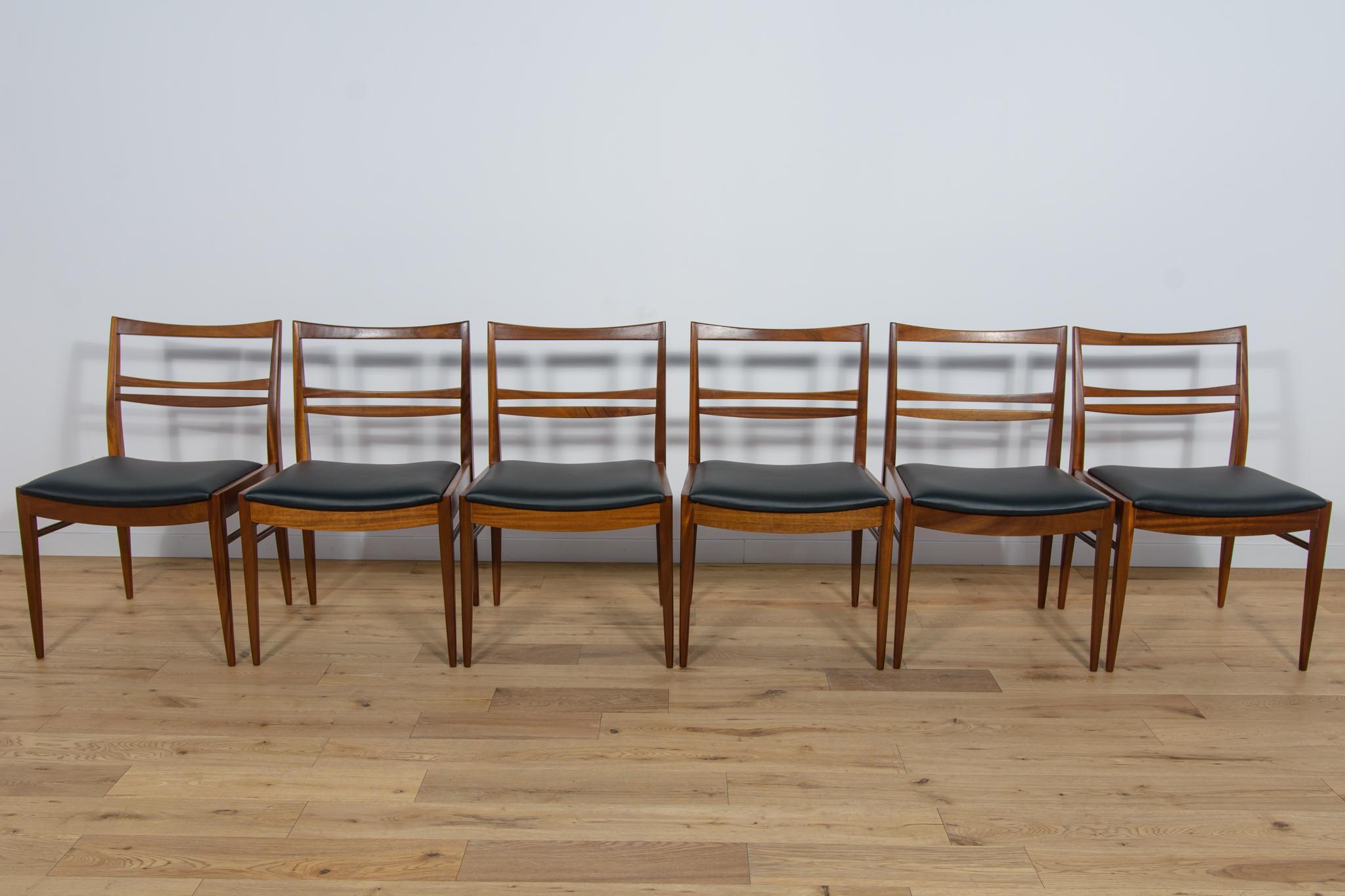 These six dining chairs were made in the United Knigdom during the 1960s. Elegant teak chairs with an interesting, light form. The teak elements have been cleaned and polished with Danish Oil. The foams have been replaced and covered with