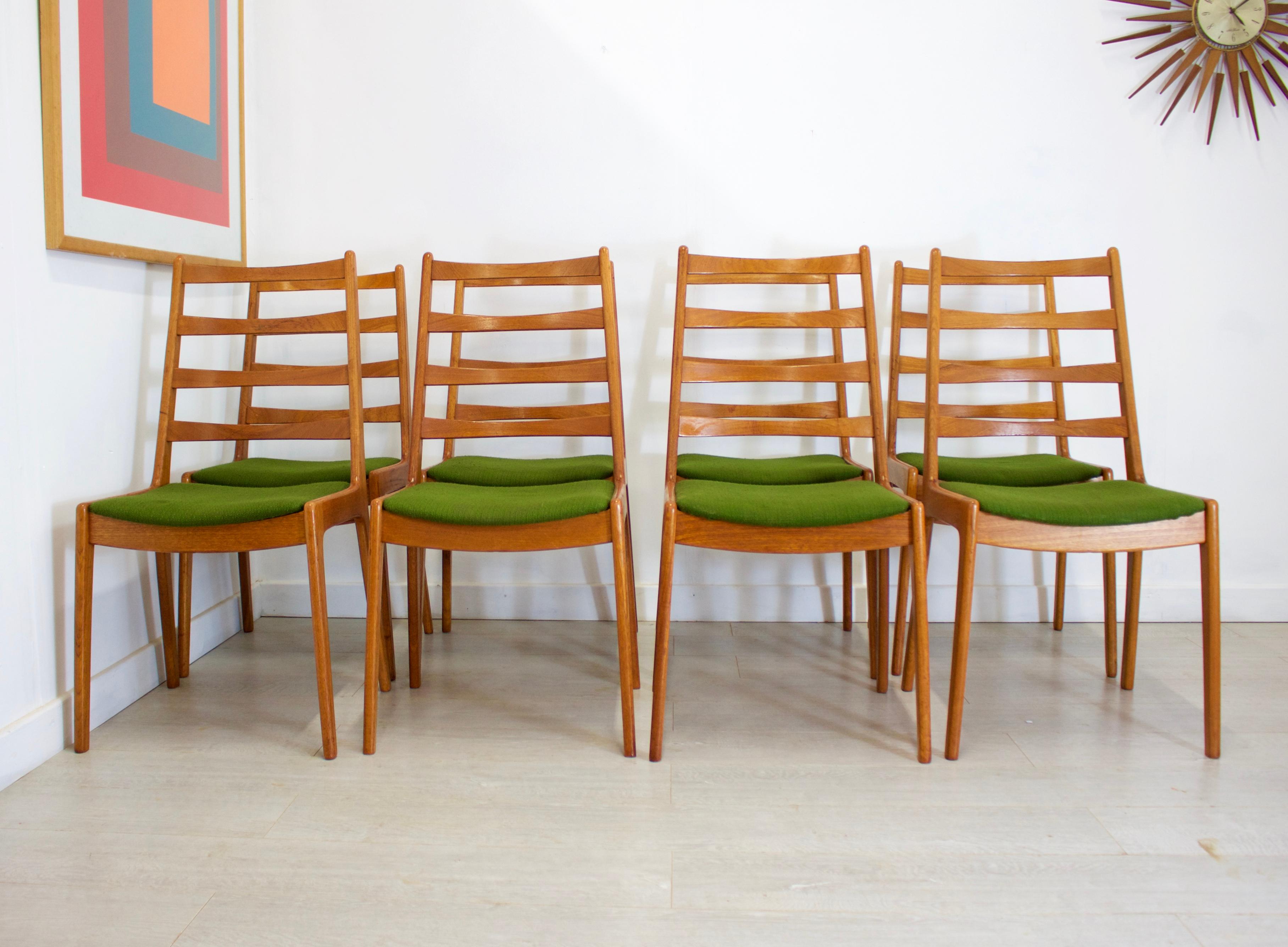 Midcentury Danish design

- Mid-Century Modern set of 8 dining chairs
- Made in Denmark by Farso Stolefabrik
- Featuring a green upholstery (not original)
- Made from teak.