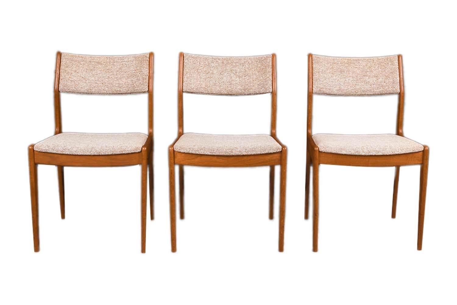 A set of three, extremely sought after, gorgeous 1960s, modern teak side/dining chairs by the Scandinavia Woodworks Co., made in Singapore. Featuring a matching set of three, each remains in original condition throughout. Features teak frames, with