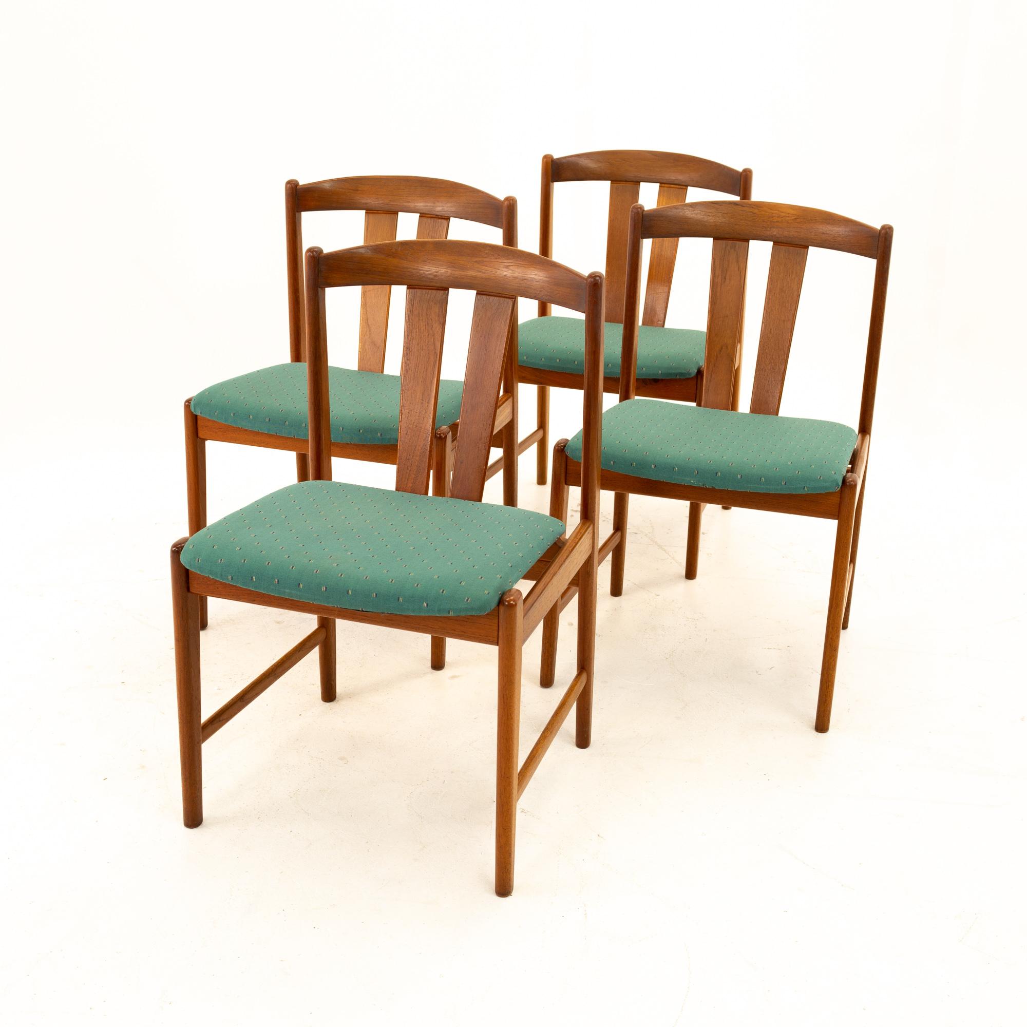 Mid Century teak dining chairs, set of 4
Each chair measures: 19.25 wide x 17.5 deep x 30.75 high with a seat height of 17.75 inches
This set is available in what we call restored vintage condition. Upon purchase, it is thoroughly cleaned and minor