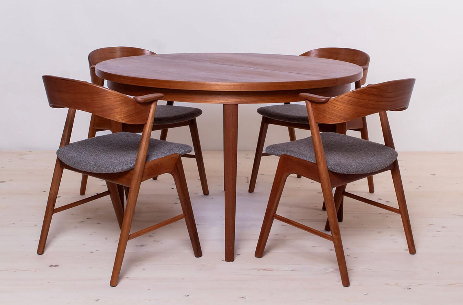 Absolutely rare find! This full dining set consists of 8 chairs and 1 extendable table. The set was produced around 1960s by KORUP Stolefabrik. Designed in the manner of Kai Kristinasen (also known as model 32), but there is no official