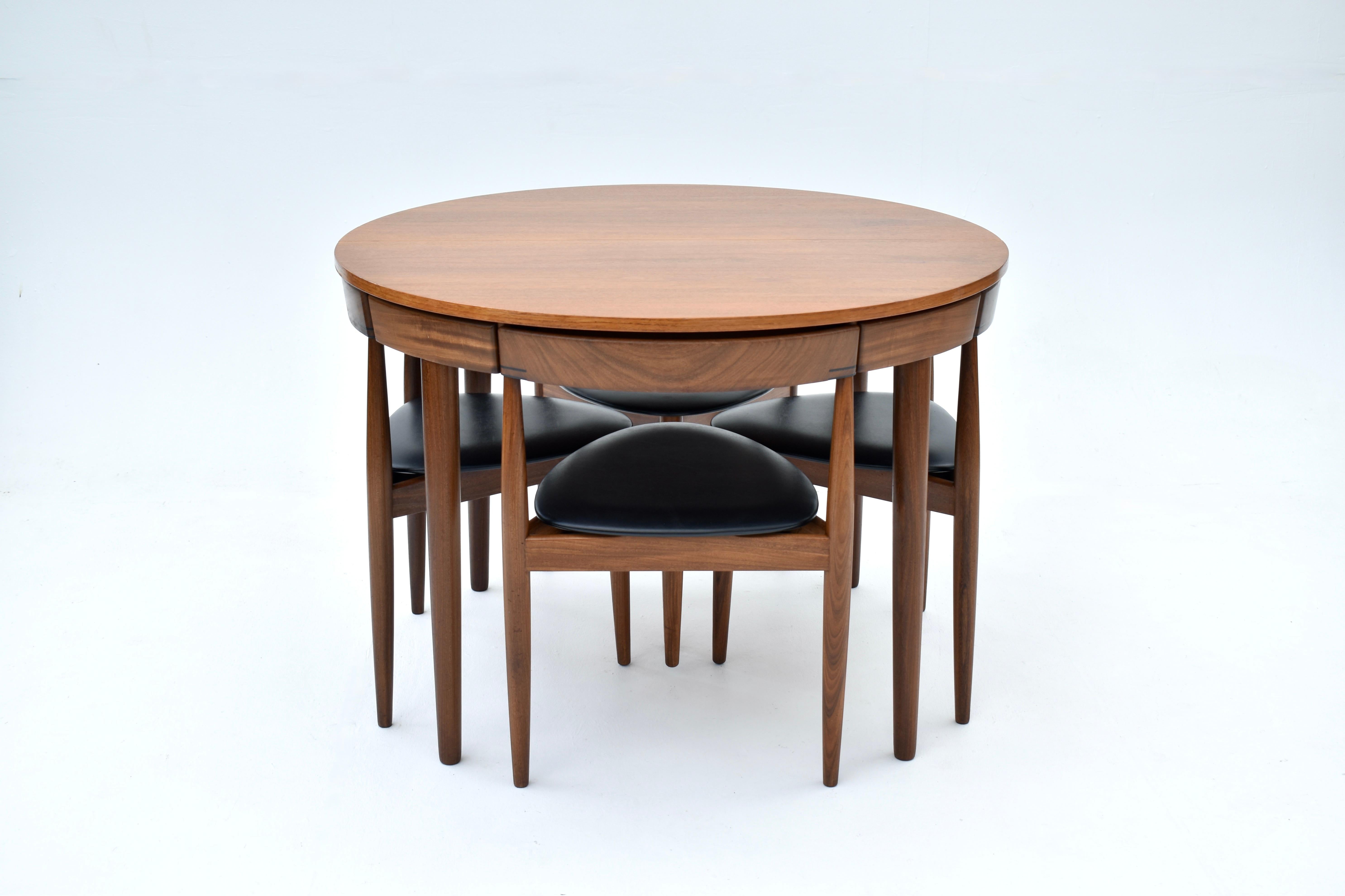 A Danish design classic. The prettiest and most compact dining set you can find.

The table diameter is just 106cm. Each chair designed to fit snug underneath the table apron and becoming integral to the design. A very aesthetically pleasing design