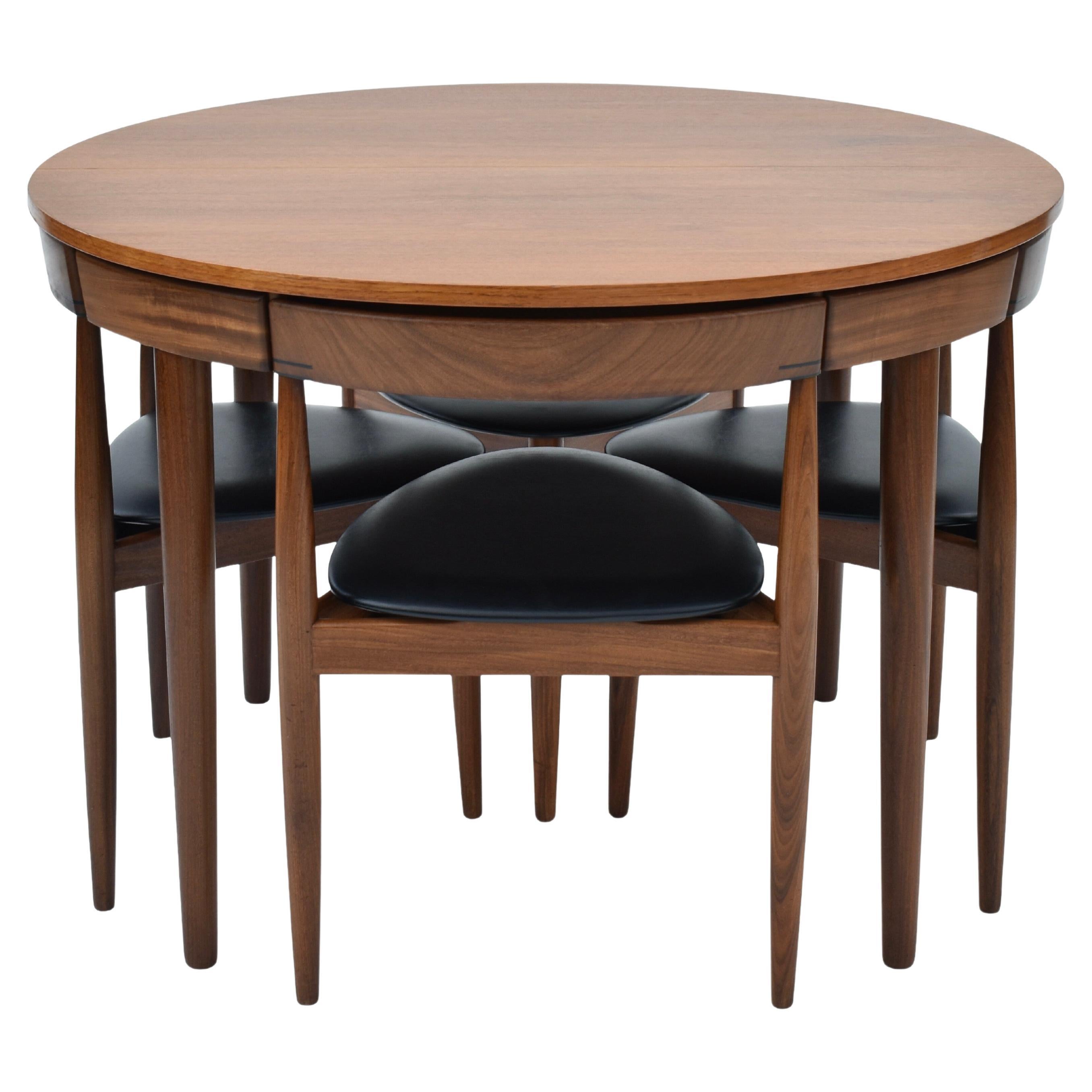 How many chairs fit around a 60-inch round table?