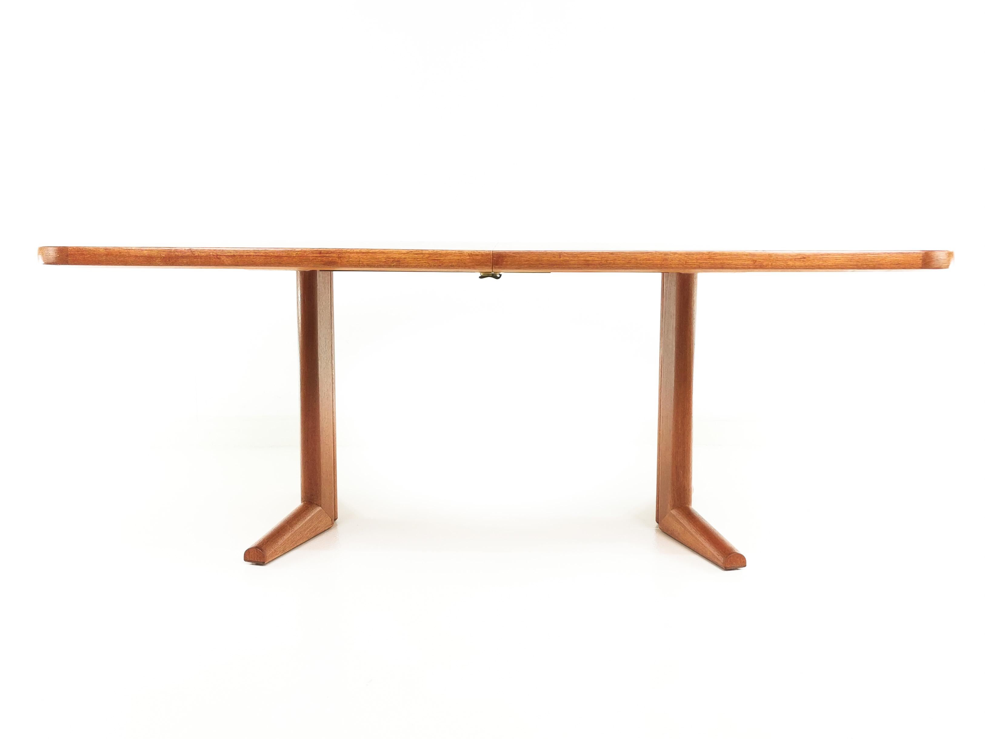 Gordon Russell teak dining table

Designed for Gordon Russell Ltd by Martin Hall, this beautiful extending dining table in teak is a superb example of British design. Created to provide dining space for up to ten diners, this table extends easily