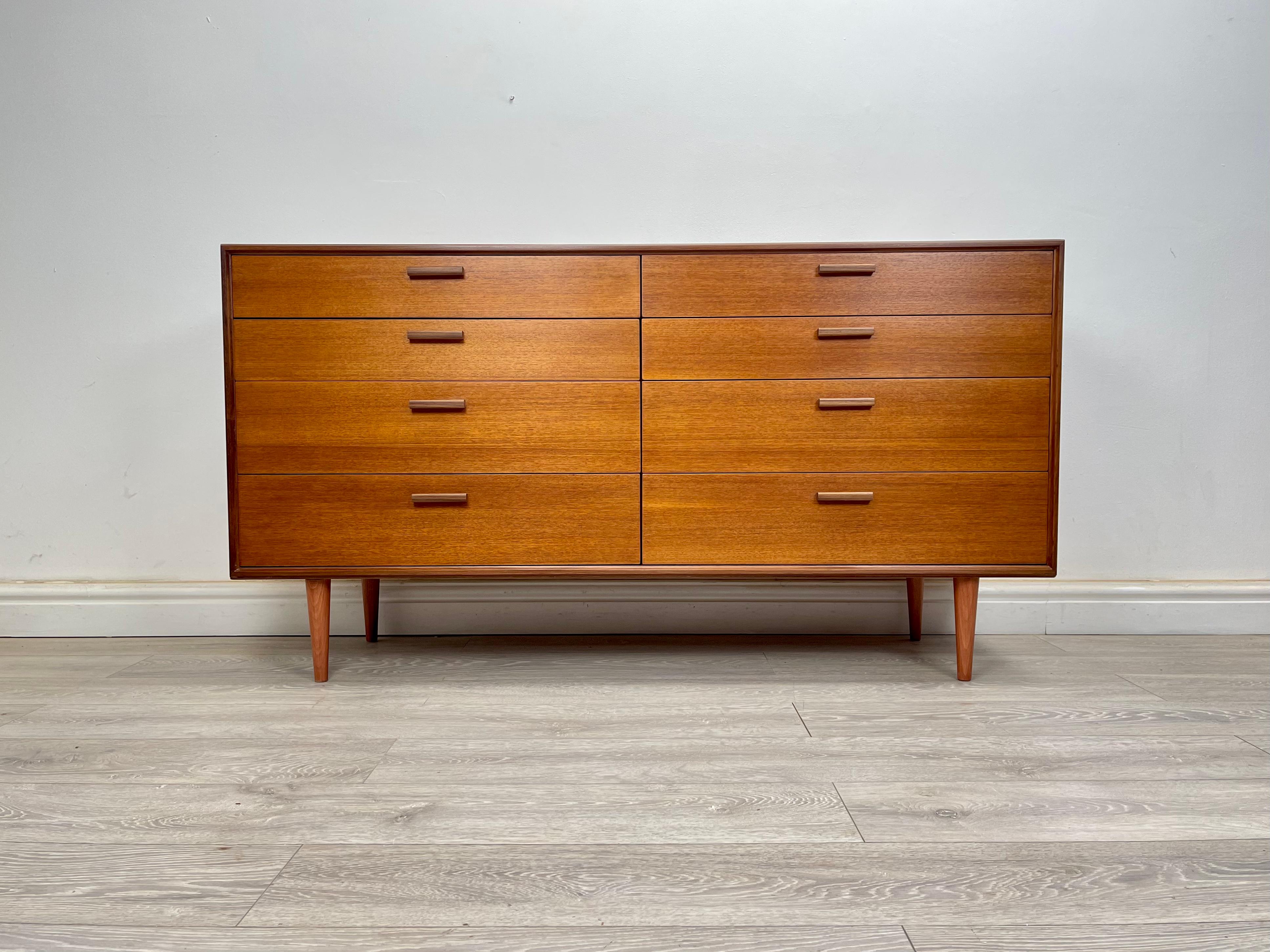 Chest of drawers 
Midcentury teak double chest of drawers made by G Plan, circa 1970s. The chest of drawers stands on round tapered legs, stunning grain and golden patina throughout. There’s eight good size drawers fitted with solid teak handles all