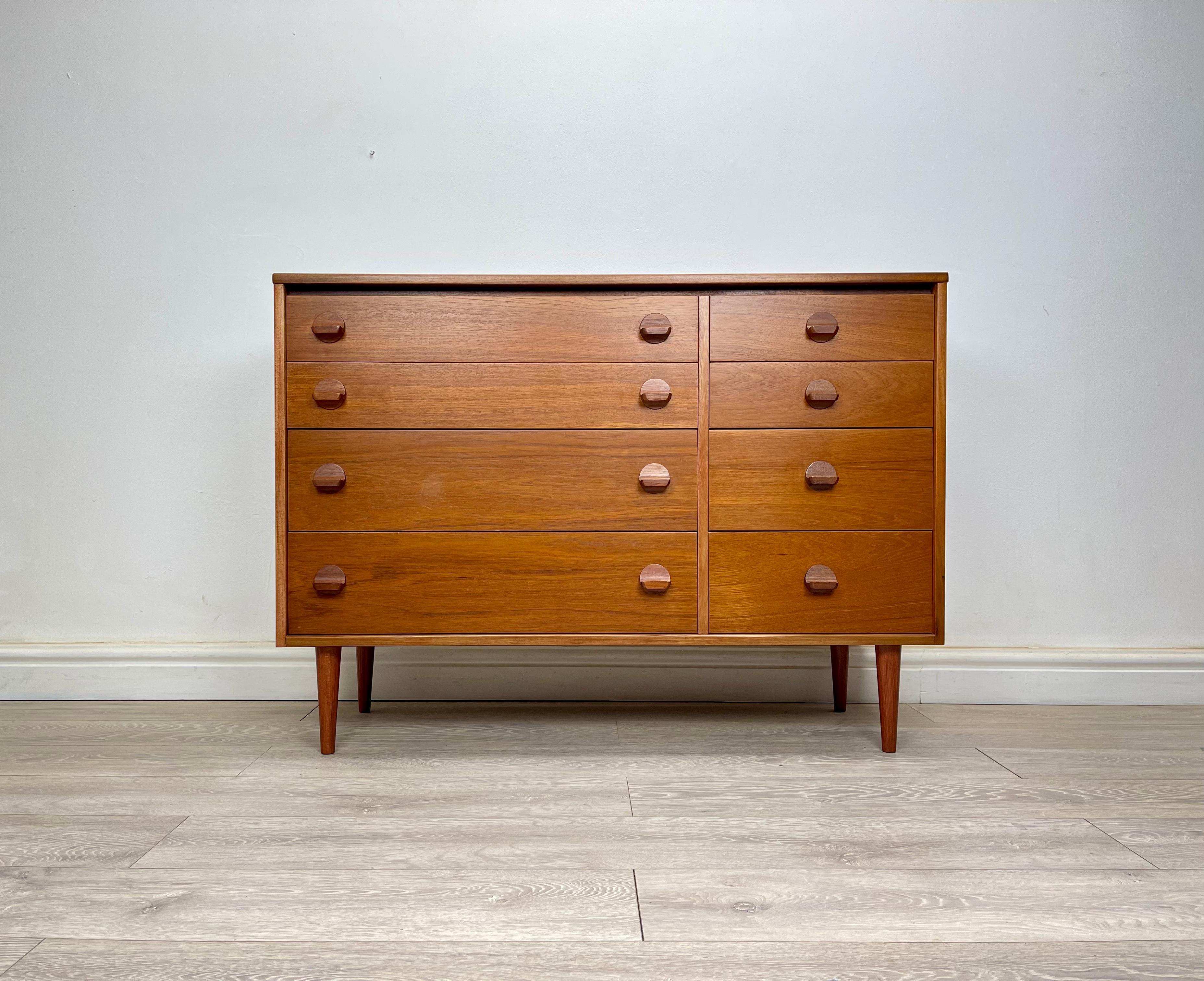 CHEST OF DRAWERS 
Mid-century teak double chest of drawers designed by John & Sylvia Reid made by stag circa 1970 . The chest has stunning grain and golden patina throughout , stands on round tapered legs , theres eight drawers with solid teak