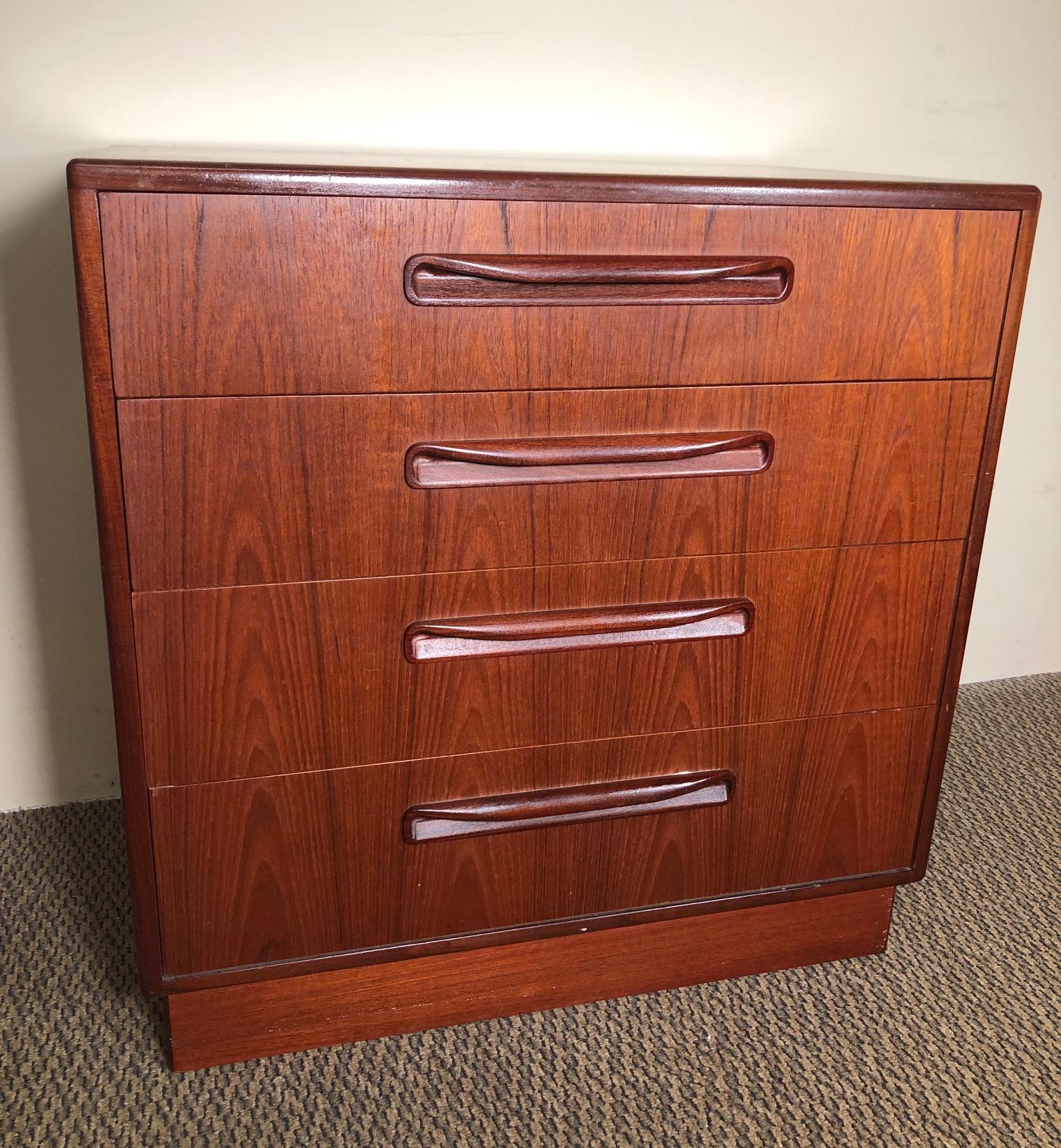 Gorgeous small teak dresser by G Plan. Excellent condition. All the drawers open and close well. Some discoloration and paint stains inside the drawers. Small are of chipping at the bottom rear corner on the right side. Some discoloration on the