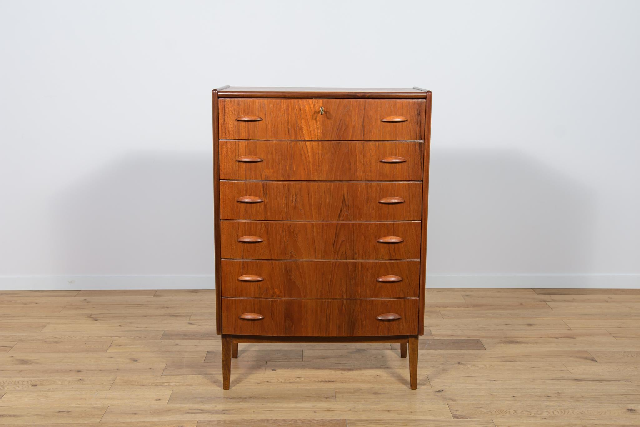 Teak dresser with six drawers made in the 1960s in Denmark. The dresser has contoured handles. The dresser has undergone a comprehensive carpentry renovation. The dresser has been cleaned of the old coating and finished with very quality Danish Oil.