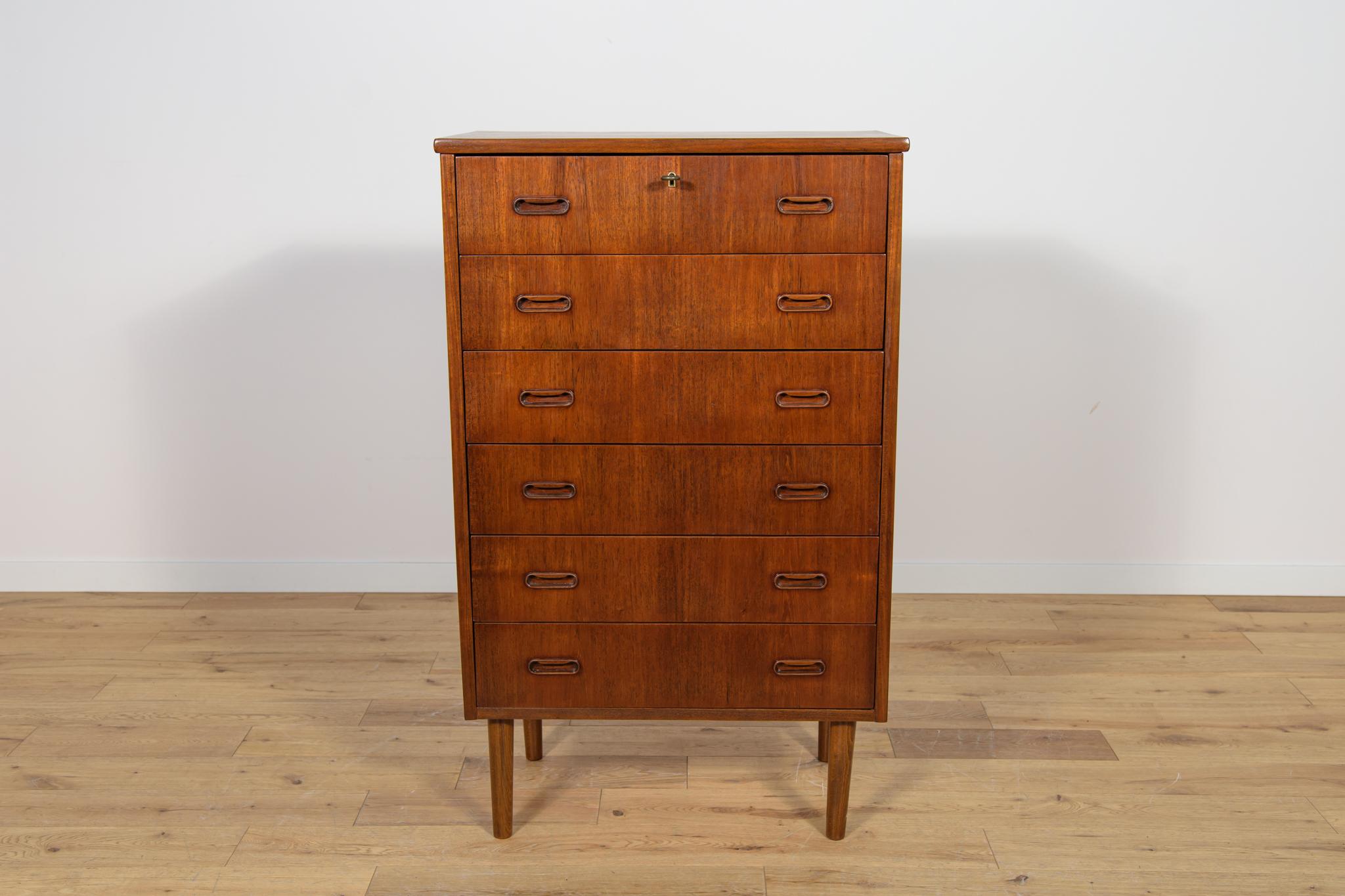 Teak dresser with six drawers made in the 1960s in Denmark. The dresser has contoured handles. The dresser has undergone a comprehensive carpentry renovation. The dresser has been cleaned of the old coating, painted teak stain finished with very