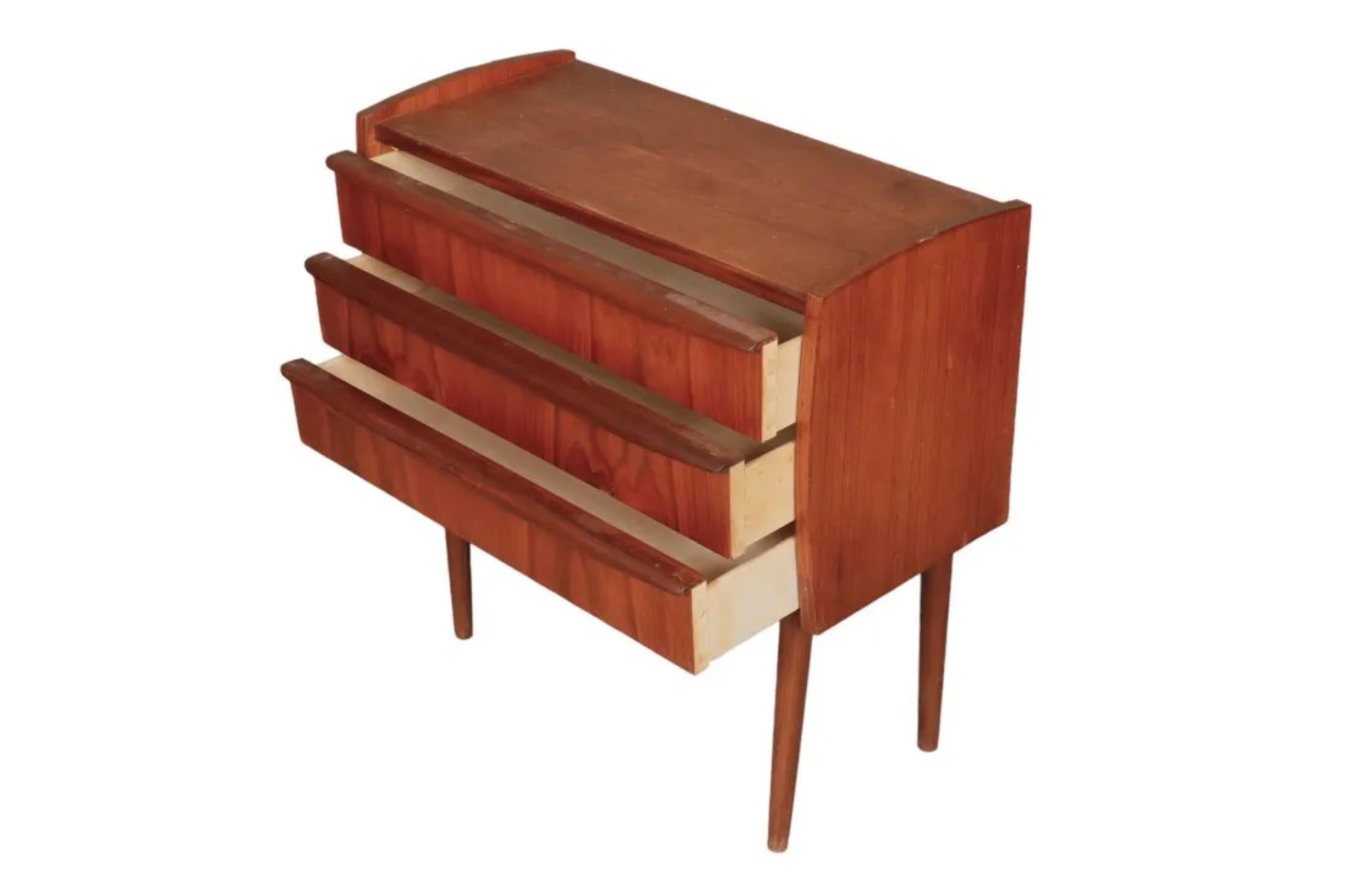Mid-Century Teak Dresser with 3 drawers 
Dimensions:
Width26 in. Depth--12in Height26 in.
Very good Condition considering Use & Age
