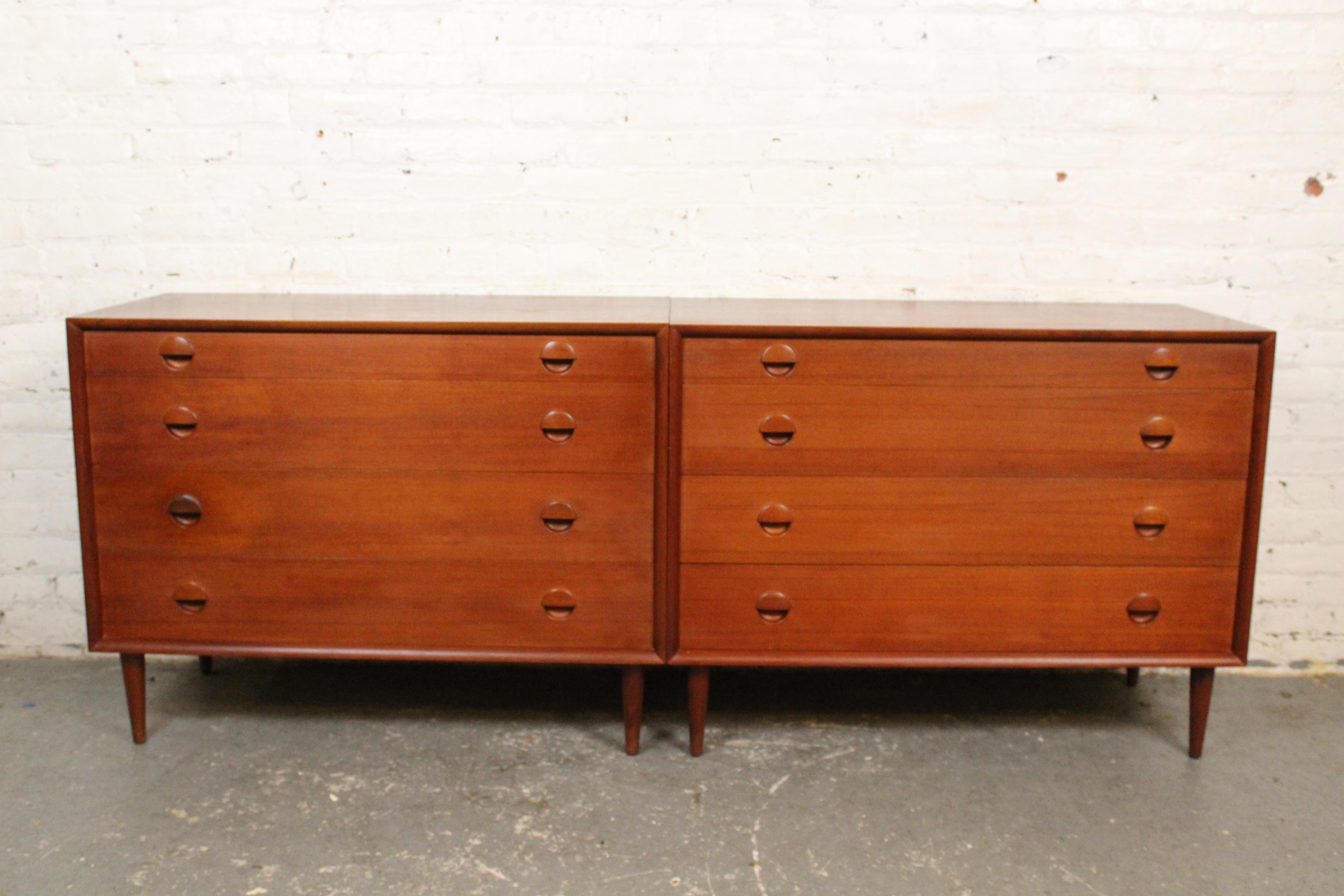 Embrace the subtle elegance of genuine mid-century Danish Modern design with this exquisite pair of matching dressers designed by Grete Jalk for the master craftsmen of Sibast Furniture. Constructed of stunning natural teak wood, each dresser sports