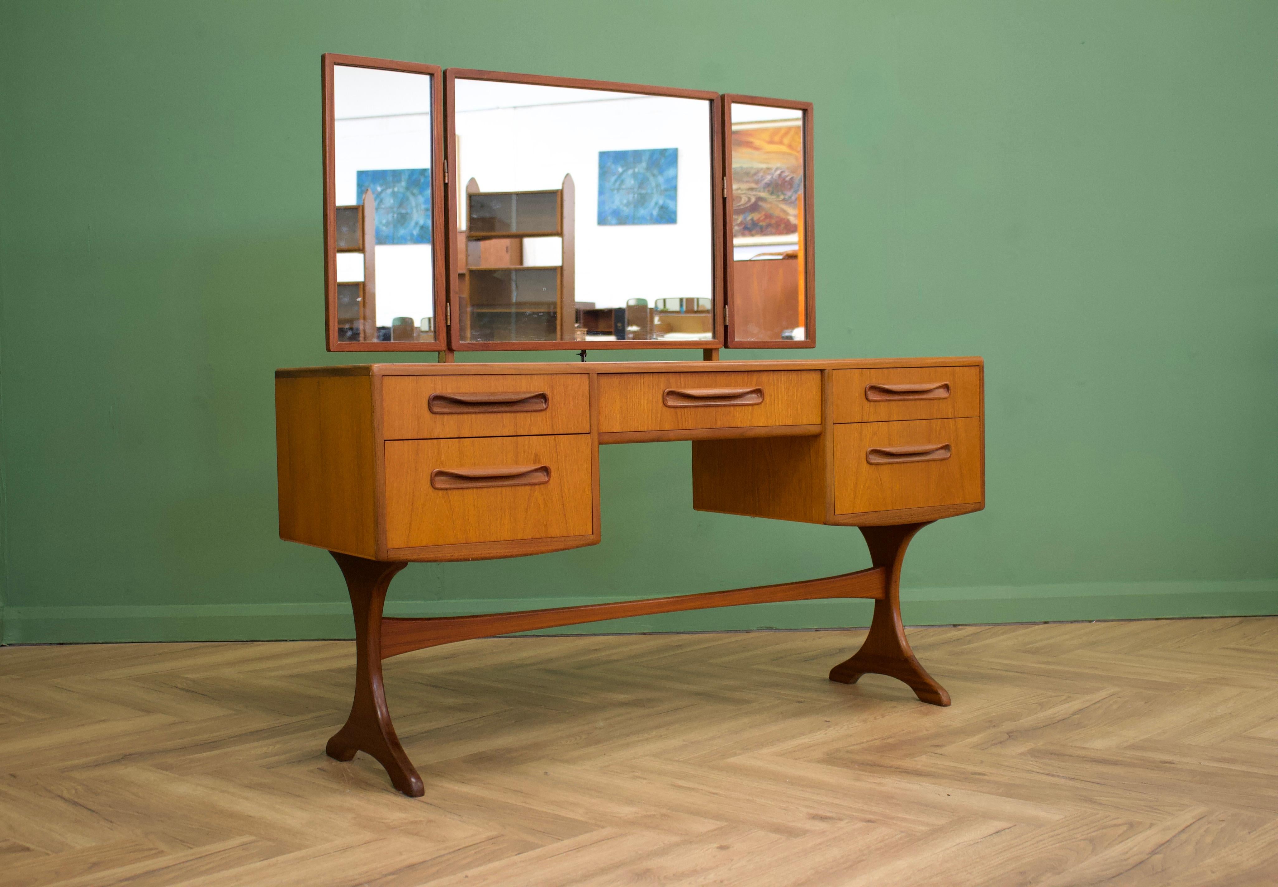 - Mid century dressing table 
- Manufactured in the UK by G Plan
- Made from Teak & Teak Veneer.

- Featuring 5 drawers.