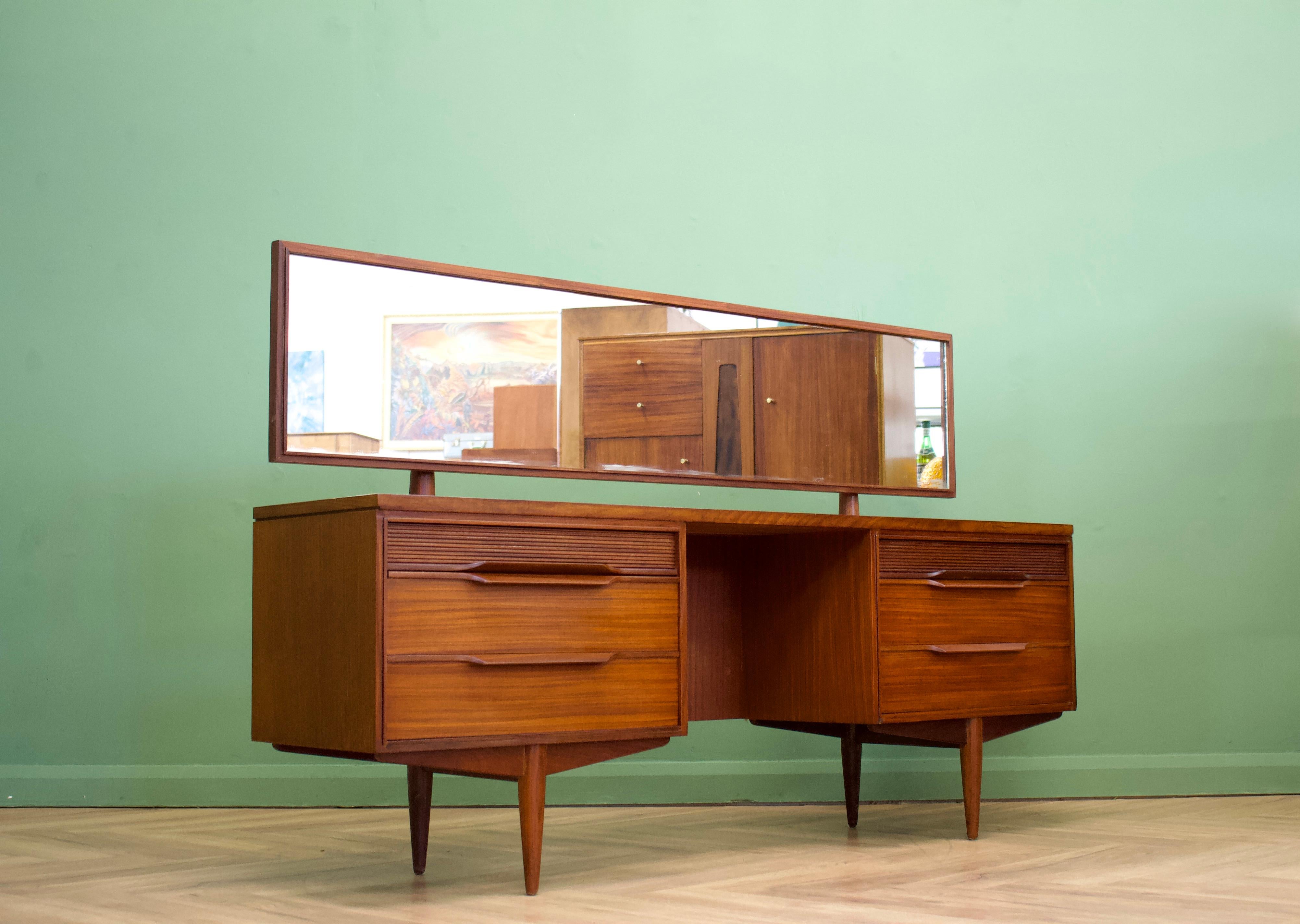 - Midcentury dressing table.
- Made in the UK by White and Newton
- Featuring six drawers and mirror

.