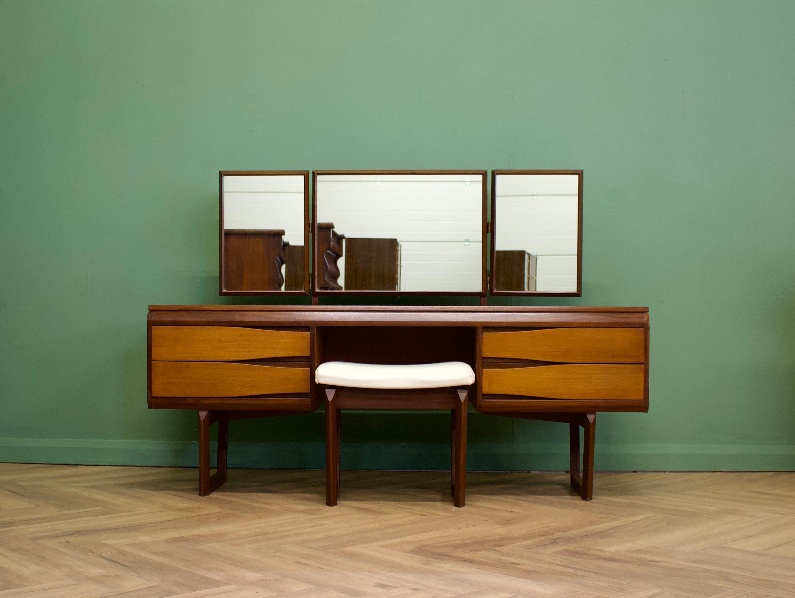 - Mid century dressing table & stool
- Manufactured in UK by White & Newton
- With triptych mirror and four drawers
- Made from teak and teak veneers
- Height to top of mirror is 113cm.