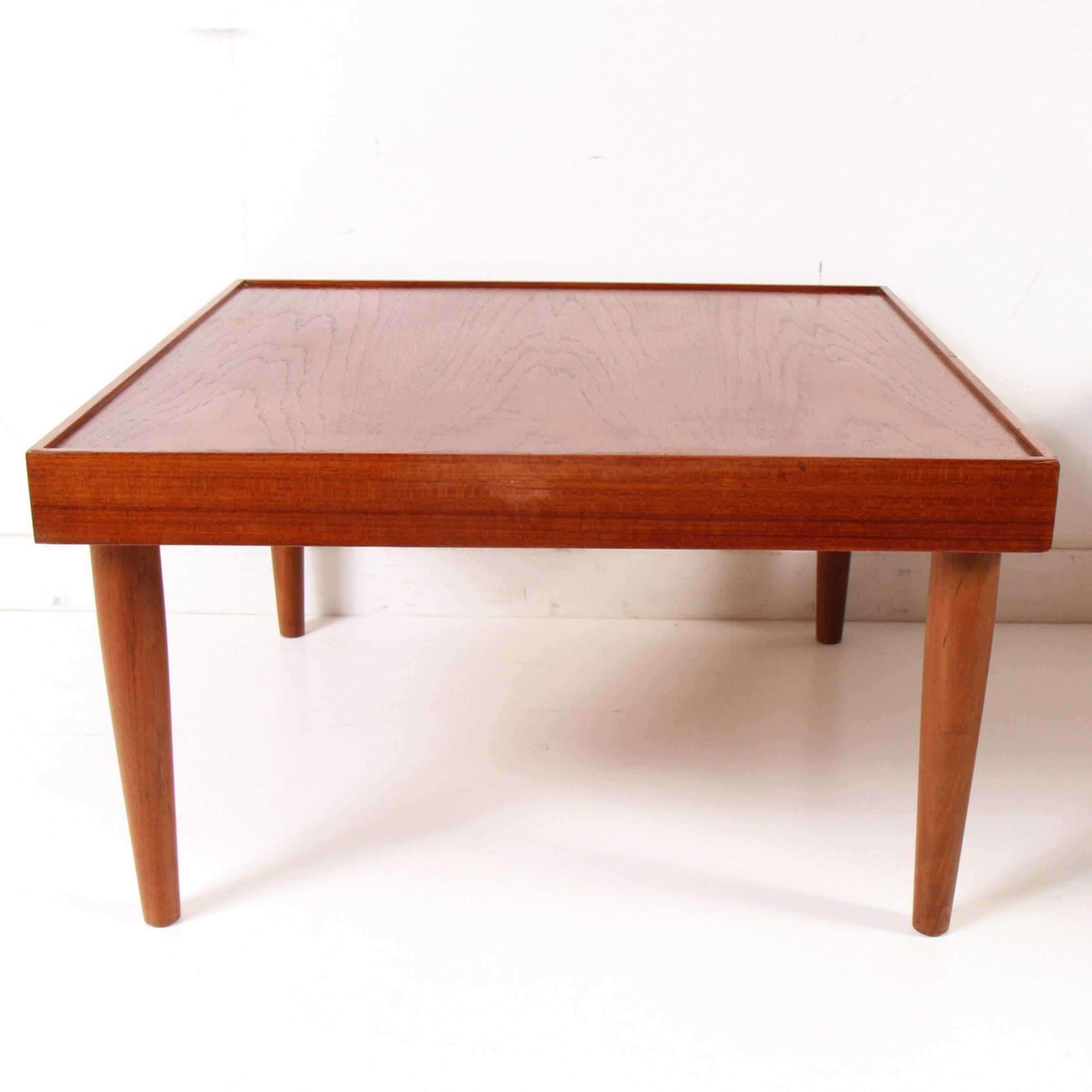 Clean set of teak side/end tables from Norway. Expected small nicks, but in generally great shape, with legs being close to perfect. They appear to be solid teak, not veneered. If needed their first refinish would make them even better.