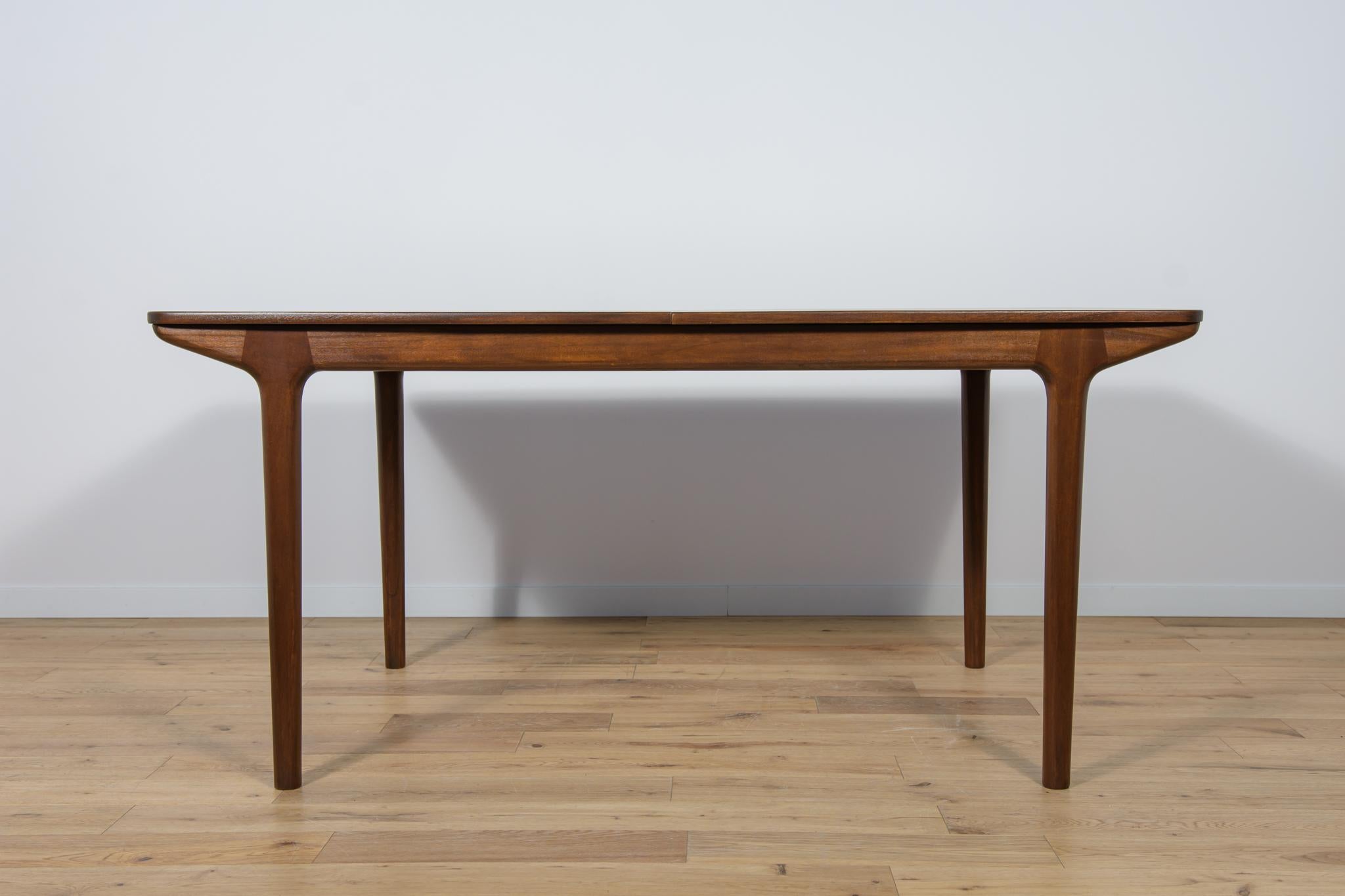 A rare model of a rectangular table with two mechanically opened extensions, made of teak wood by the British McIntosh manufactory in the 1960s. The table has undergone a thorough renovation, cleaned of the old coating, painted ed with rosewood