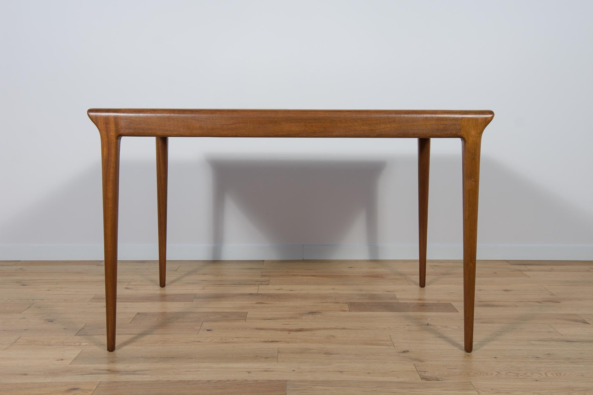 A rectangular table with a light, sublime form, manufactured by the British McIntosh manufactory in the 1960s. The table is made of teak wood, the top is veneered with zebrano wood. The table has a unique simple mechanism that facilitates unfolding.