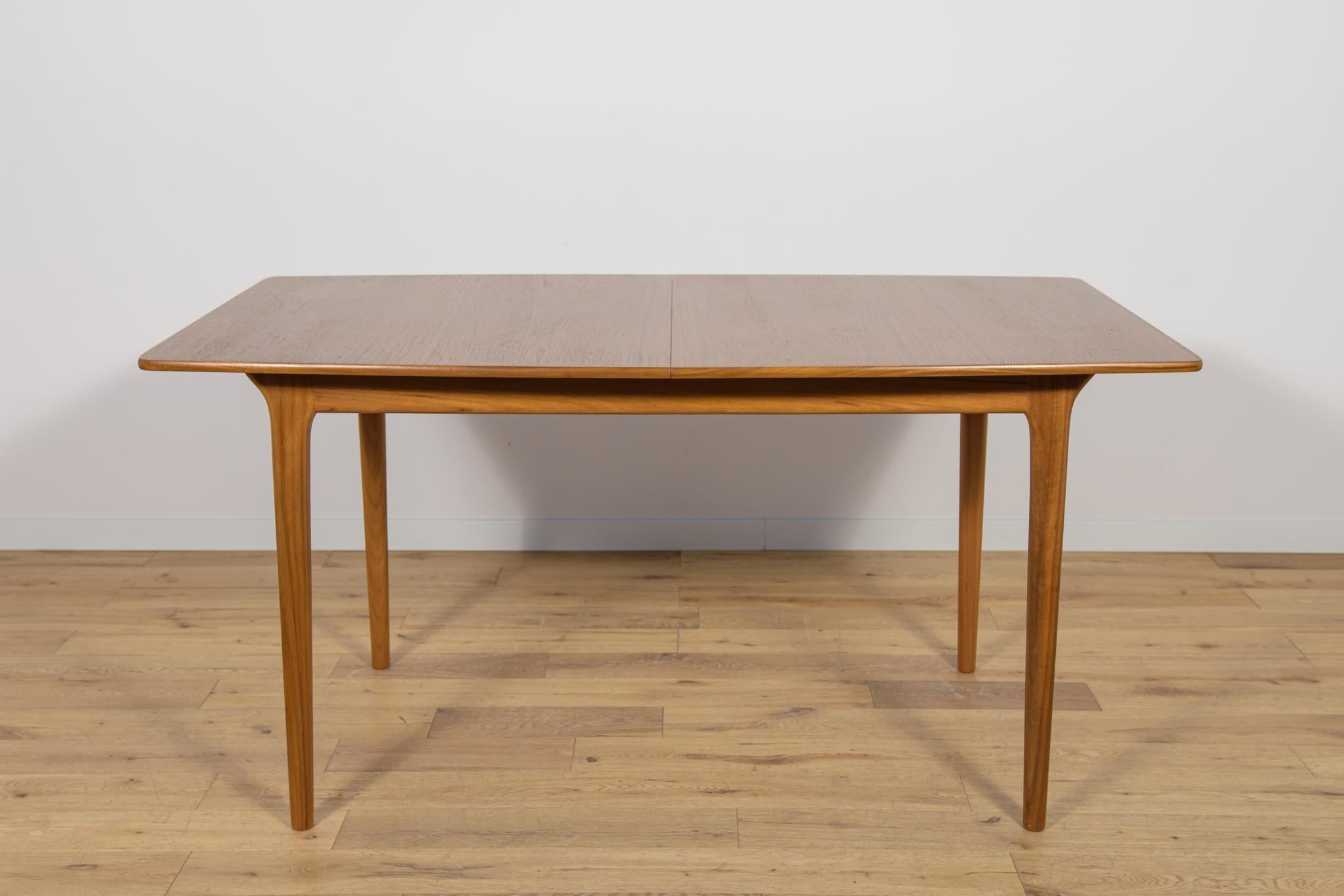 The table produced in the 1960s in Scotland by A.H. McIntosh. It is made from teak. The table has been cleaned from the old surface, painted in oak stain and polished with strong a semi-gloss lacquer.  The table measures 210 cm long when fully