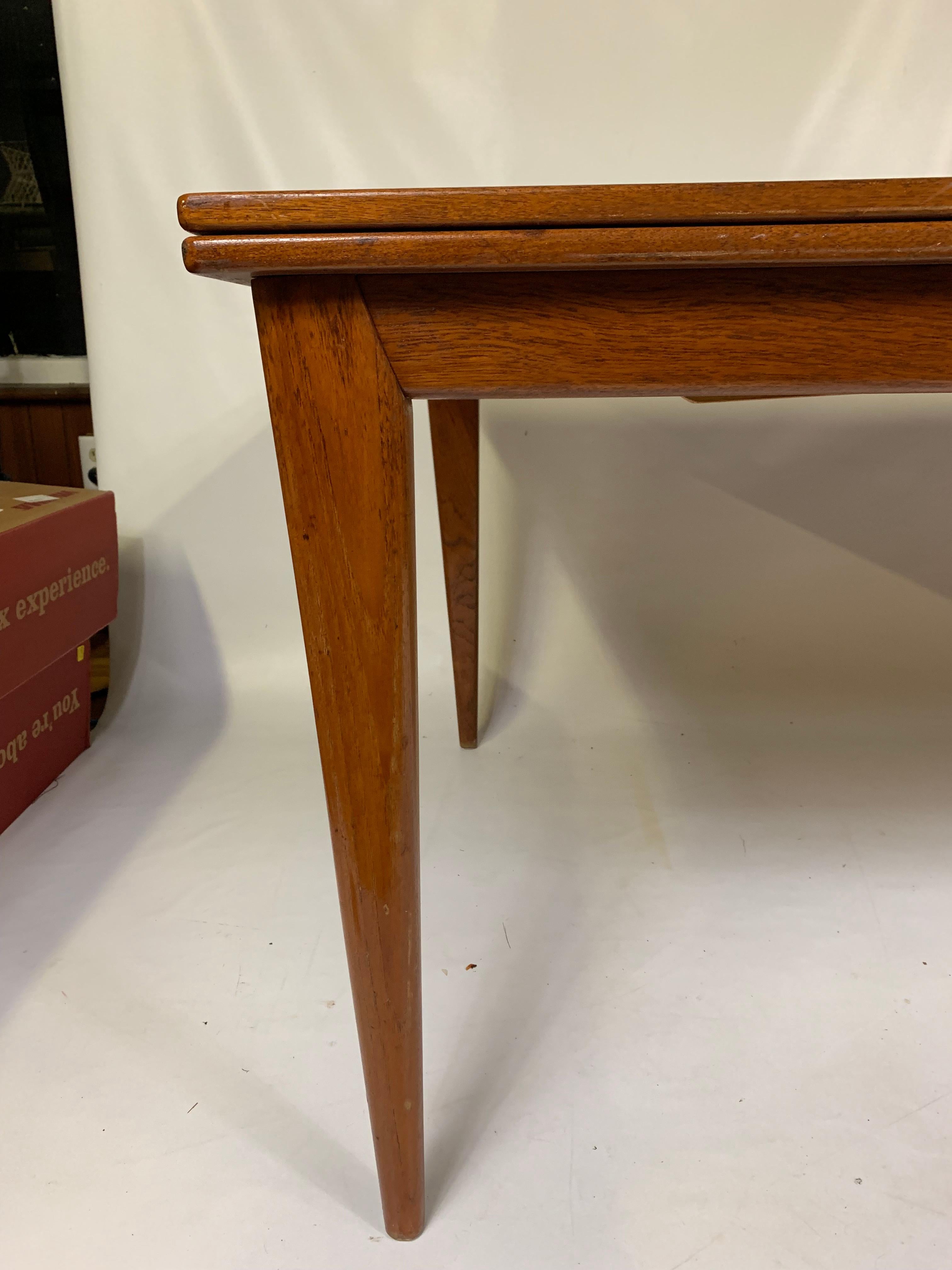 Great midcentury Danish table. The table can be used as a dining table or conference table. Table not extended it is 70.75”.