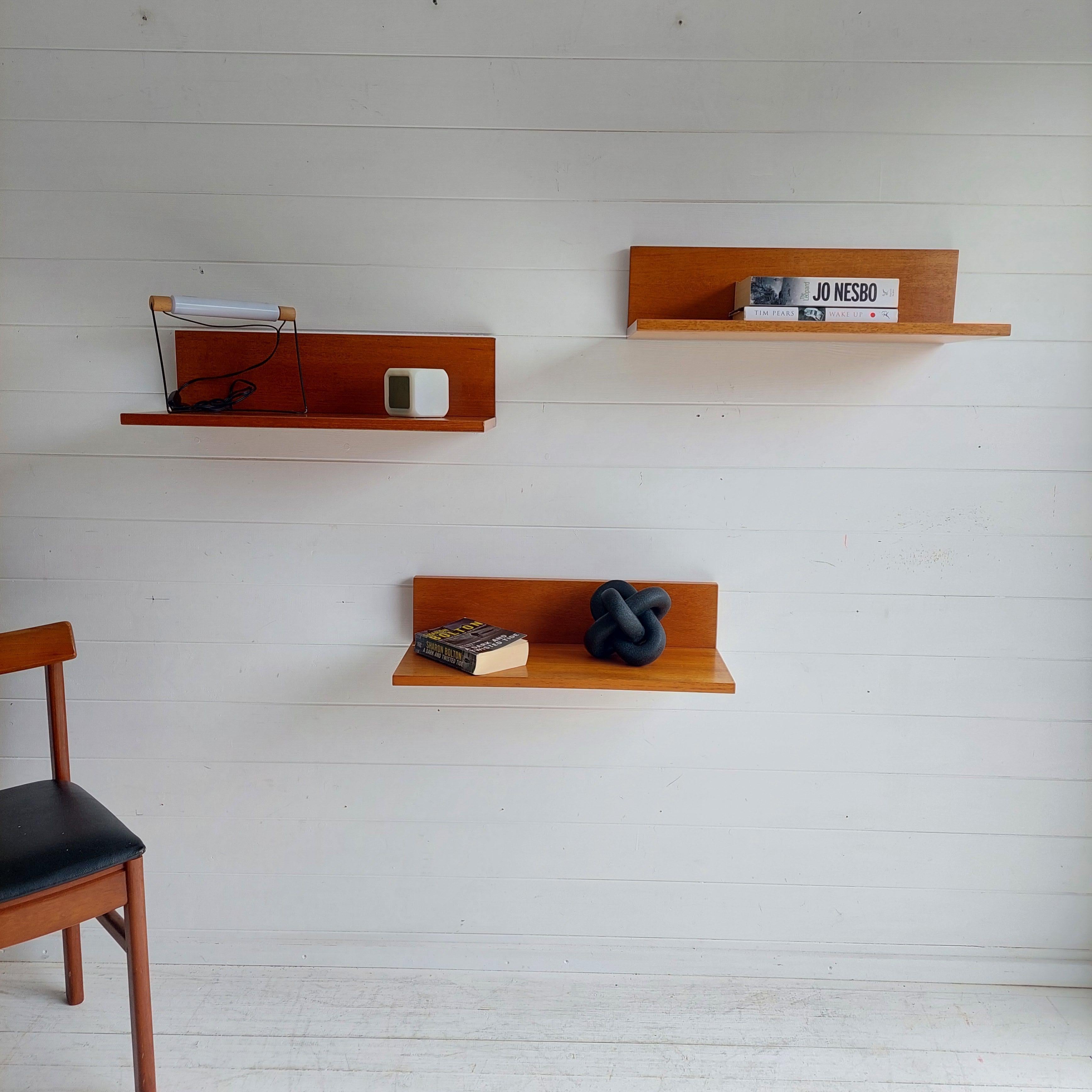 Mid Century Teak Modular Wall Ps shelves  By Beaver And Tapley
1970s teak Beaver and Tapley wall floating shelves, Set of 3
Designed by the world renowned Robert Heritage
Model SR44
Floating wall shelves with fixings
Two are slightly deeper and